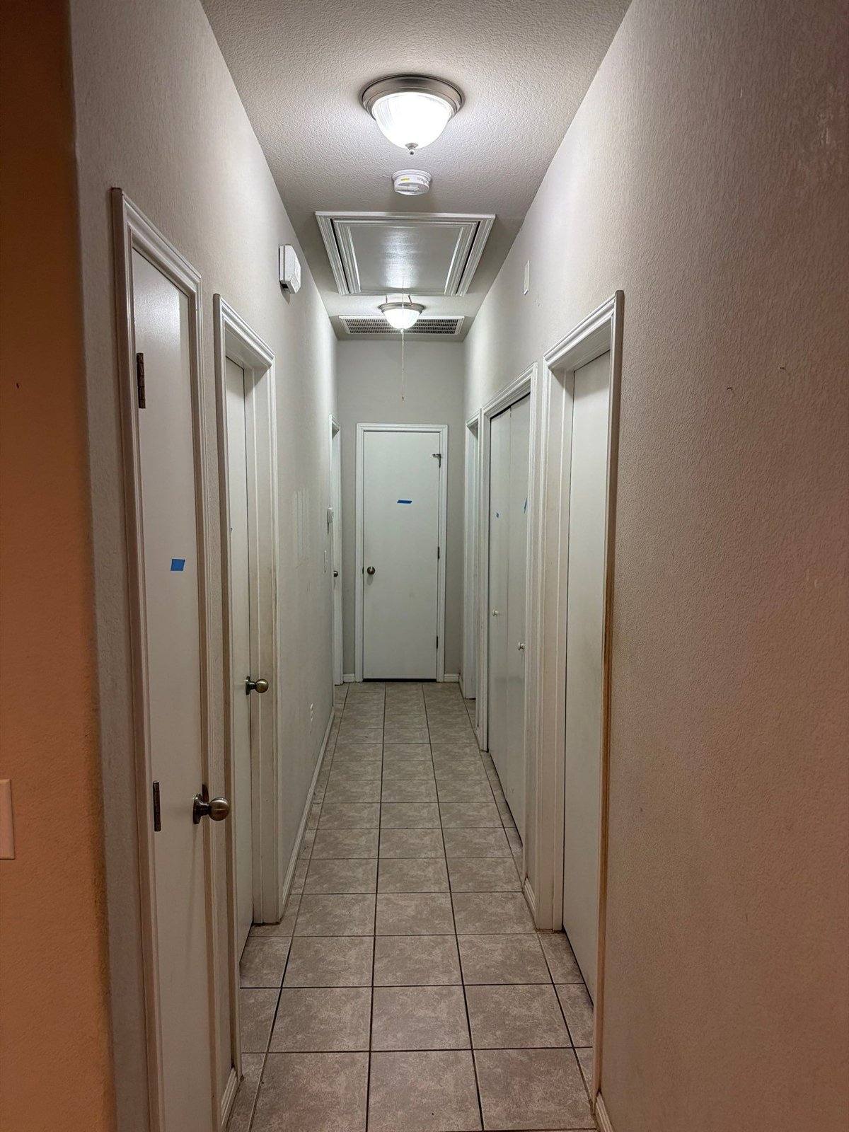 Hallway before painting in Buda, TX by Hill Country Painting