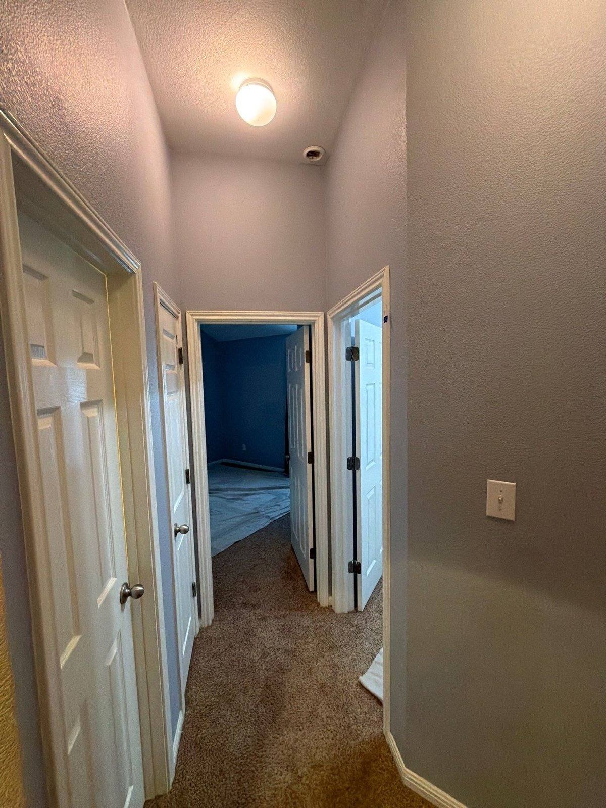 Hallway before painting in Cedar Park, TX by Hill Country Painting