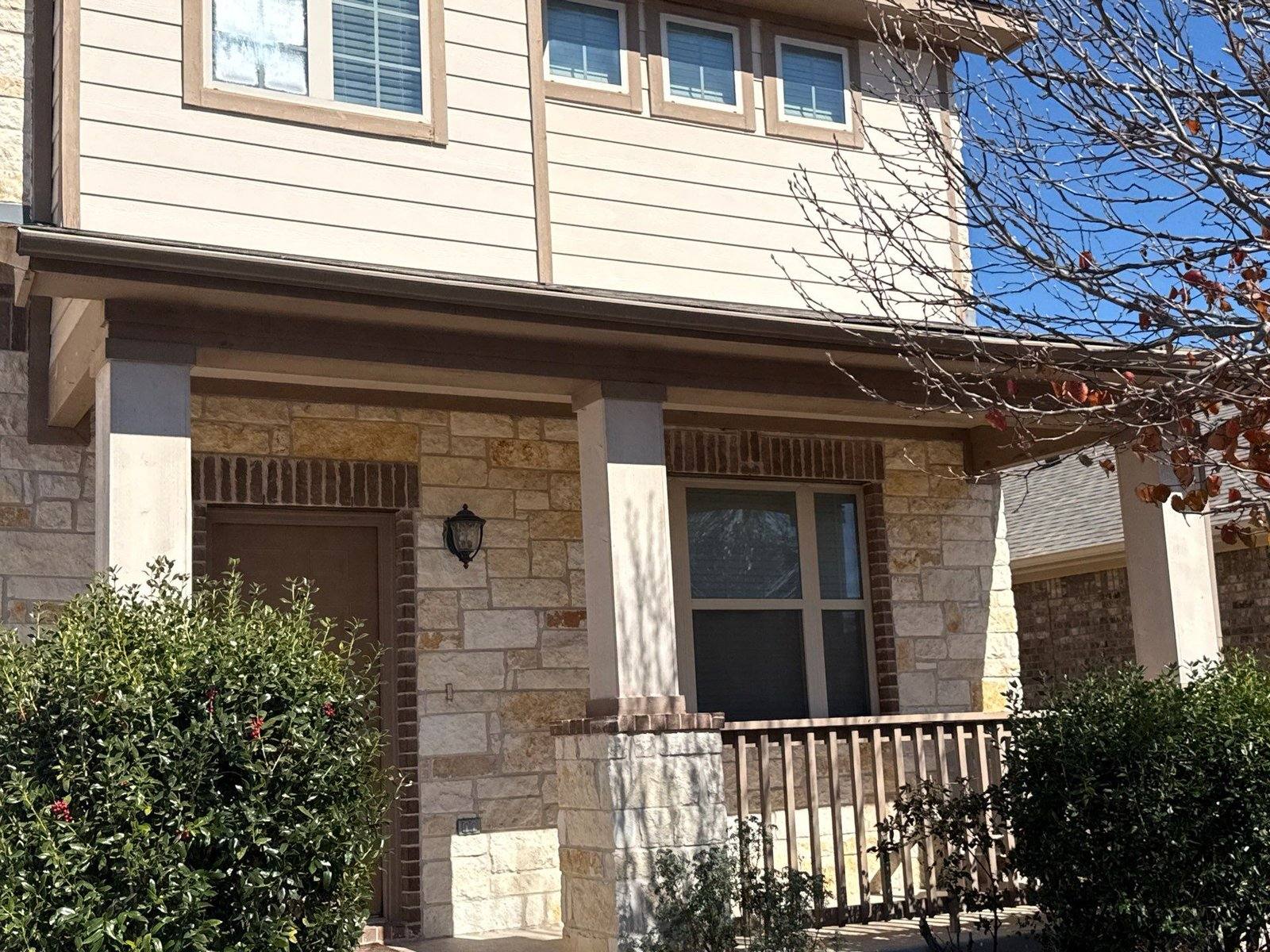 Front porch and entry before painting in Pflugerville, TX by Hill Country Painting