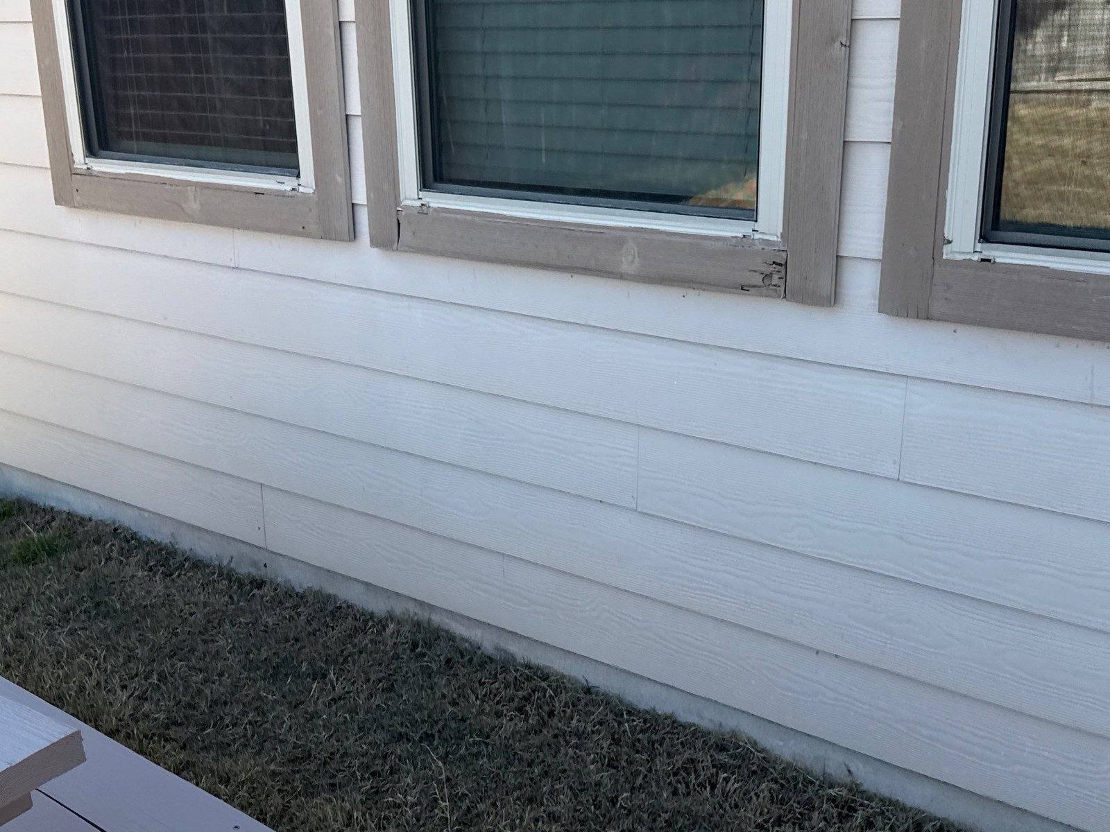 Siding and trim damage before painting in Pflugerville, TX by Hill Country Painting