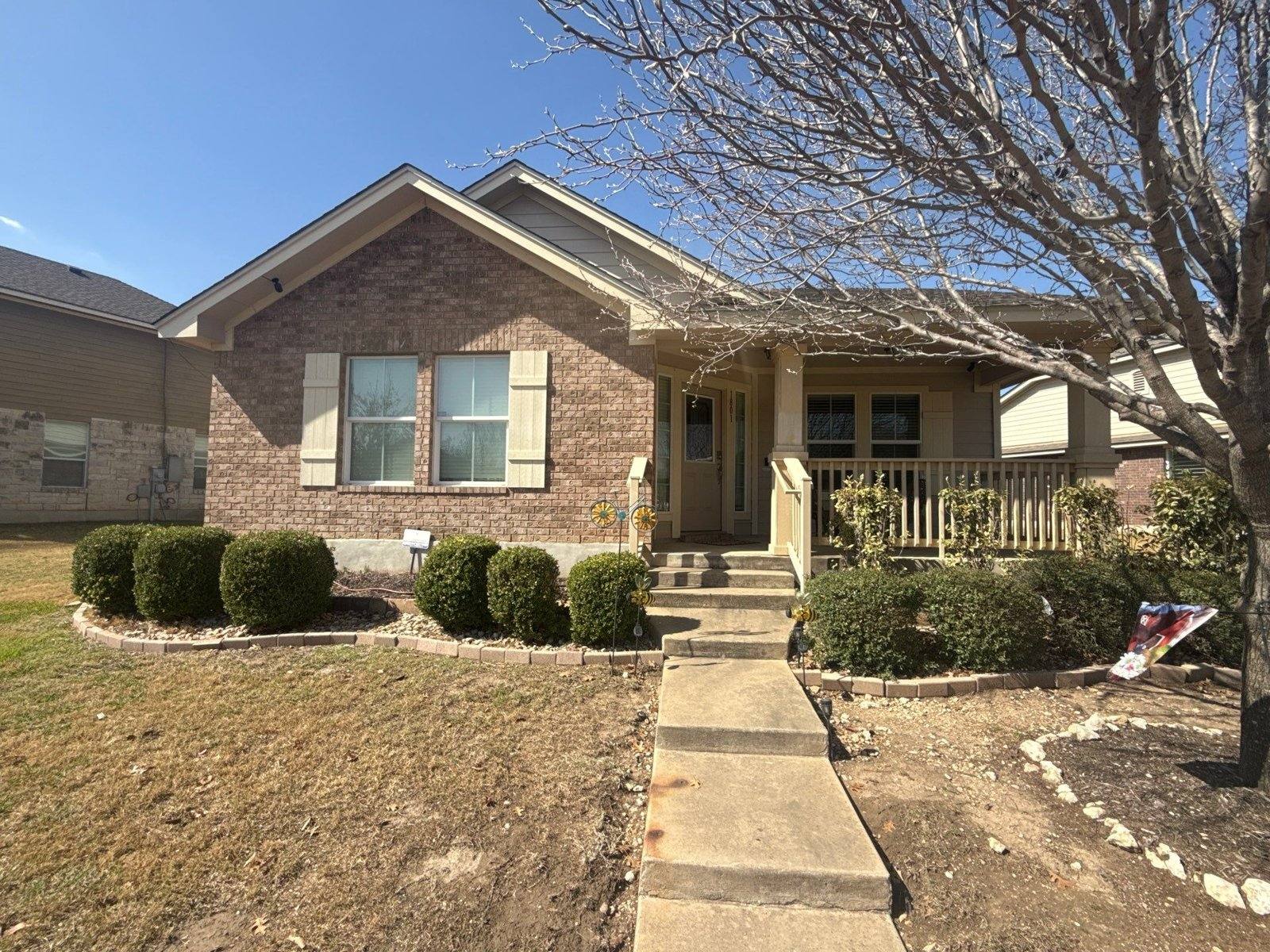 Front exterior of the home in Cedar Park, TX ahead of painting by Hill Country Painting