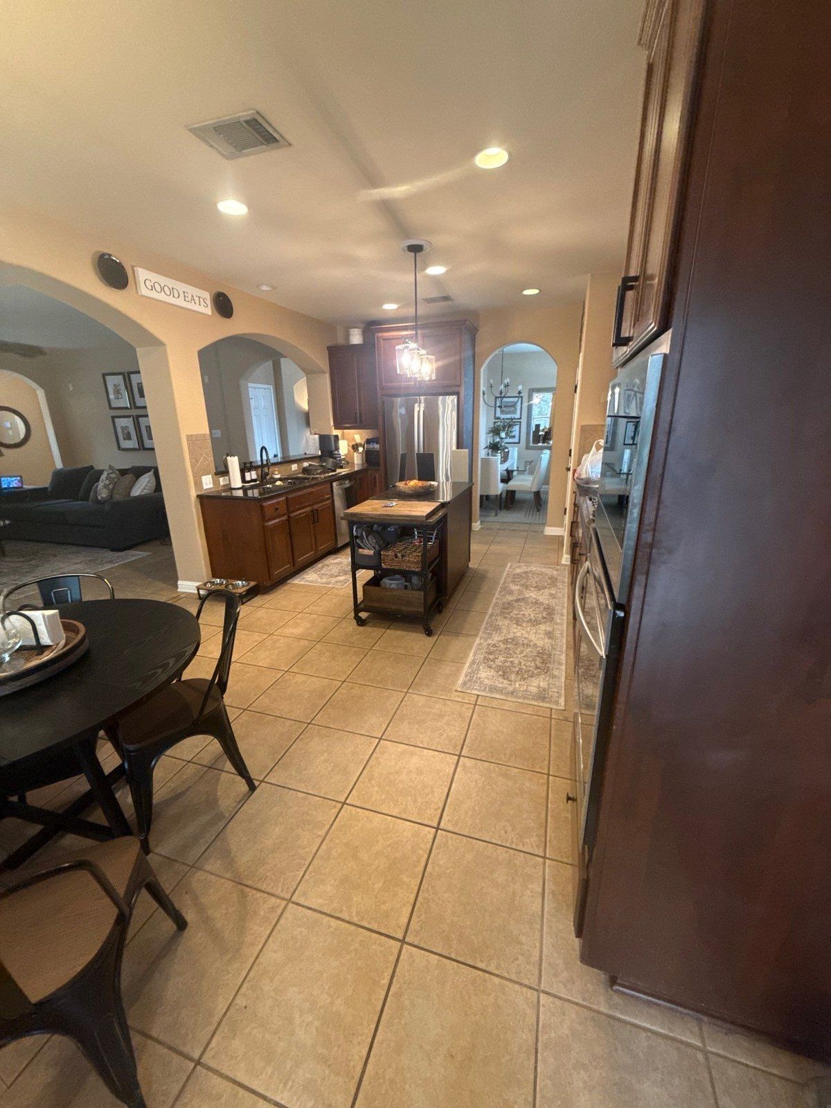 Kitchen and dining area before painting in Cedar Park, TX by Hill Country Painting