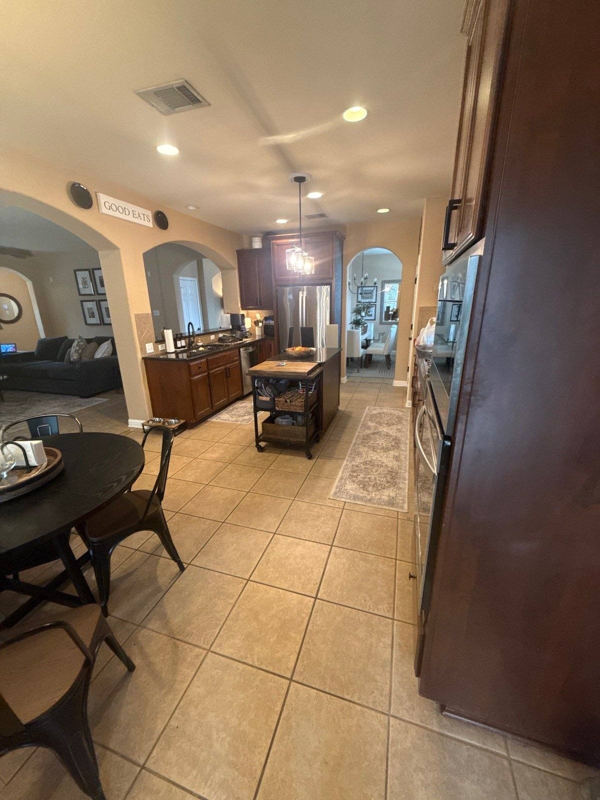 Kitchen and dining area before painting in Cedar Park, TX by Hill Country Painting