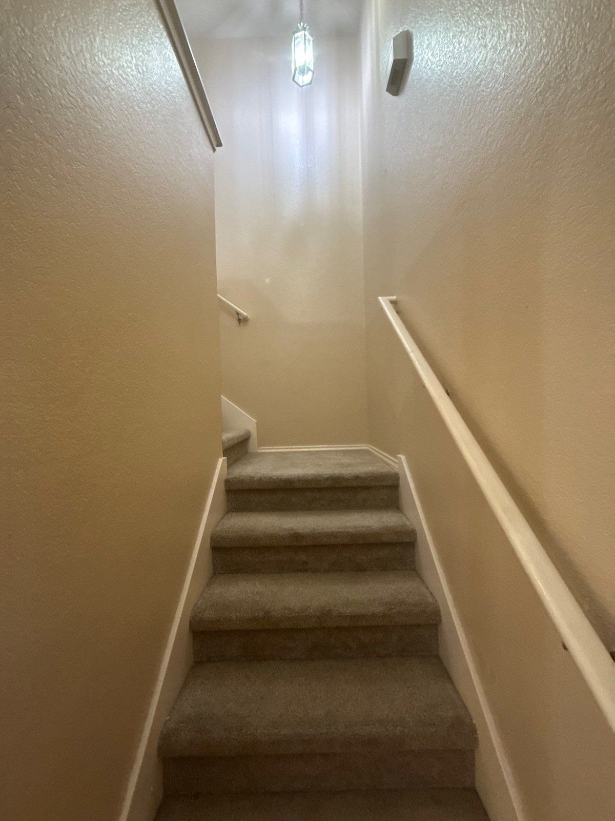 Stairwell before painting in Cedar Park, TX by Hill Country Painting