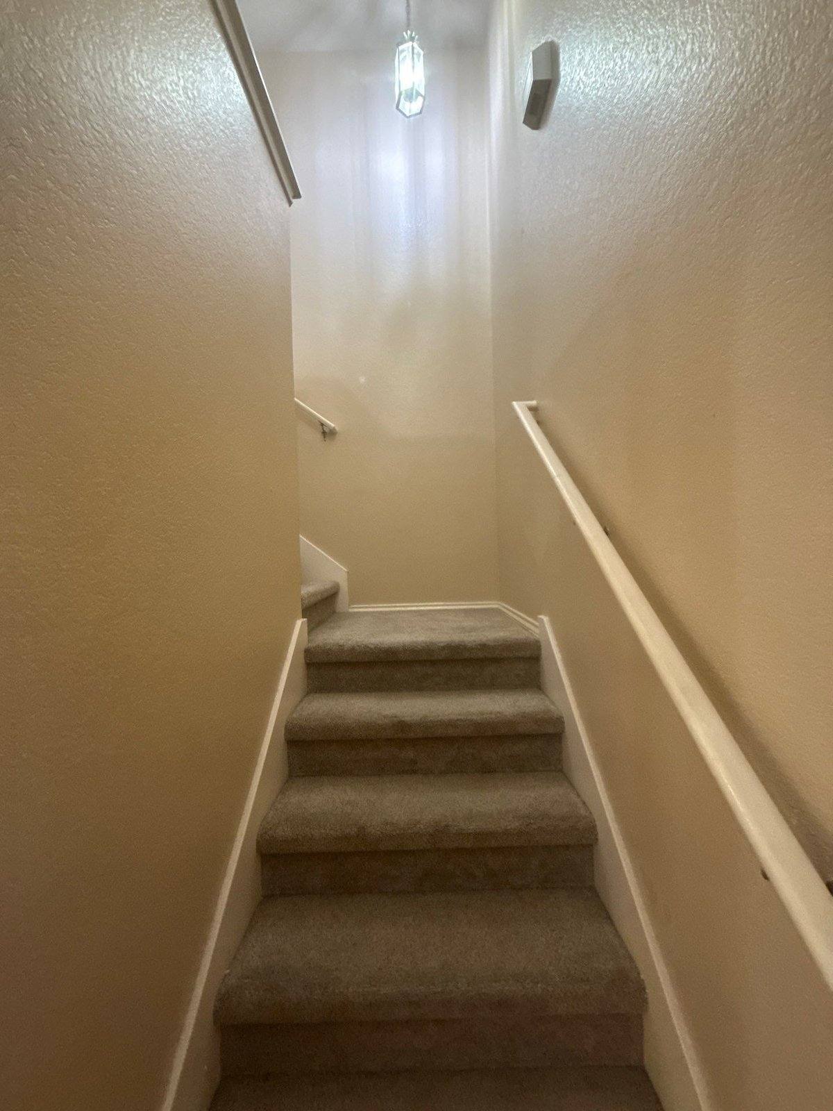 Stairwell before painting in Cedar Park, TX by Hill Country Painting