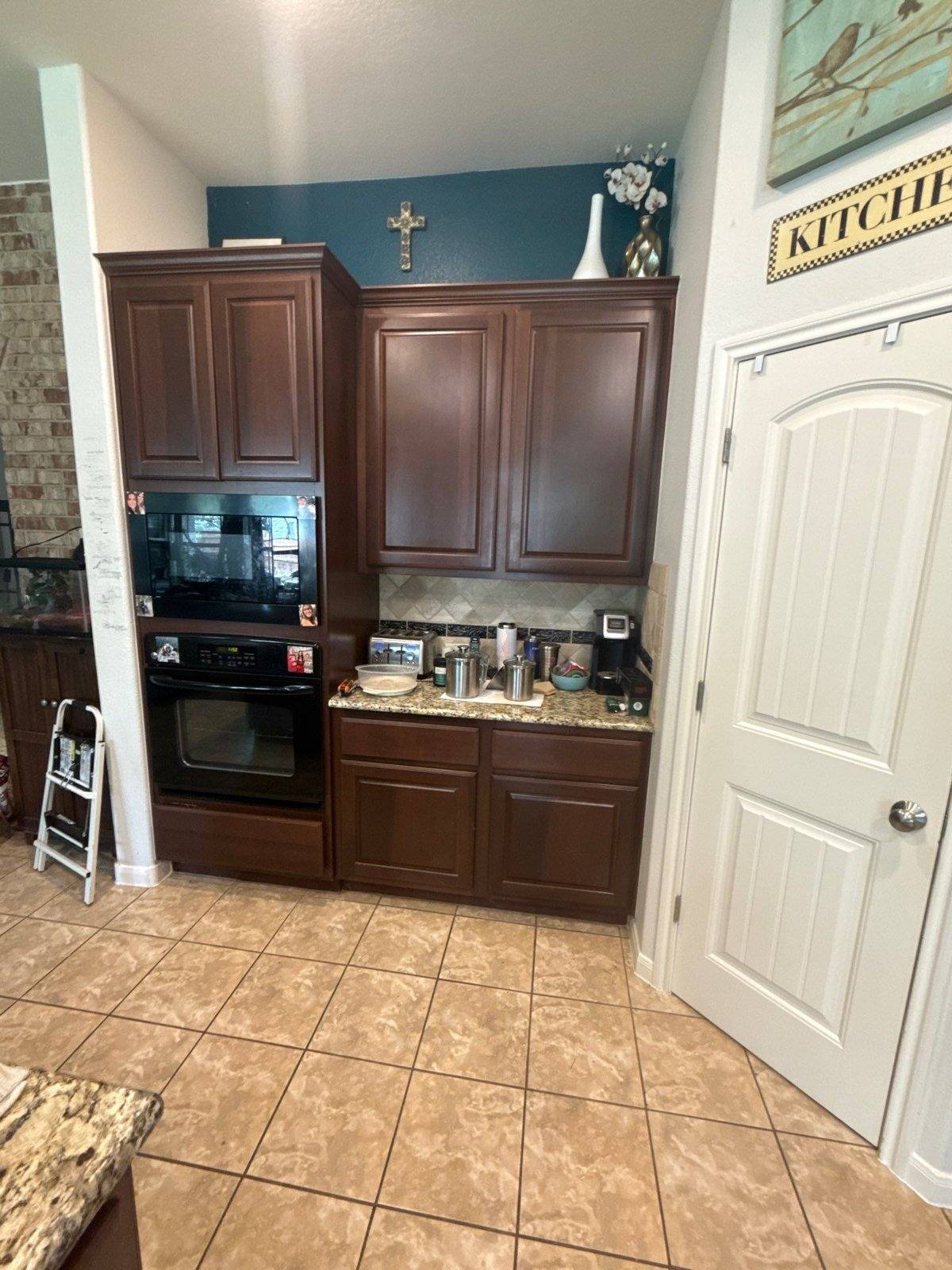 Kitchen cabinets before painting in Cedar Park, TX by Hill Country Painting