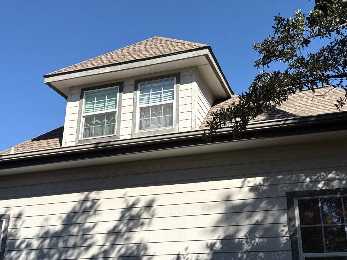 Second-story dormer before exterior painting in Dripping Springs, TX by Hill Country Painting