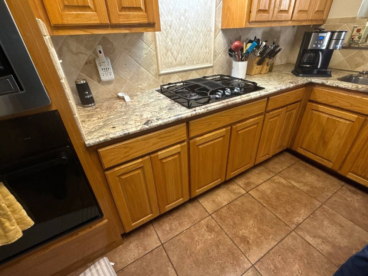 Kitchen cabinets before painting in Austin, TX by Hill Country Painting