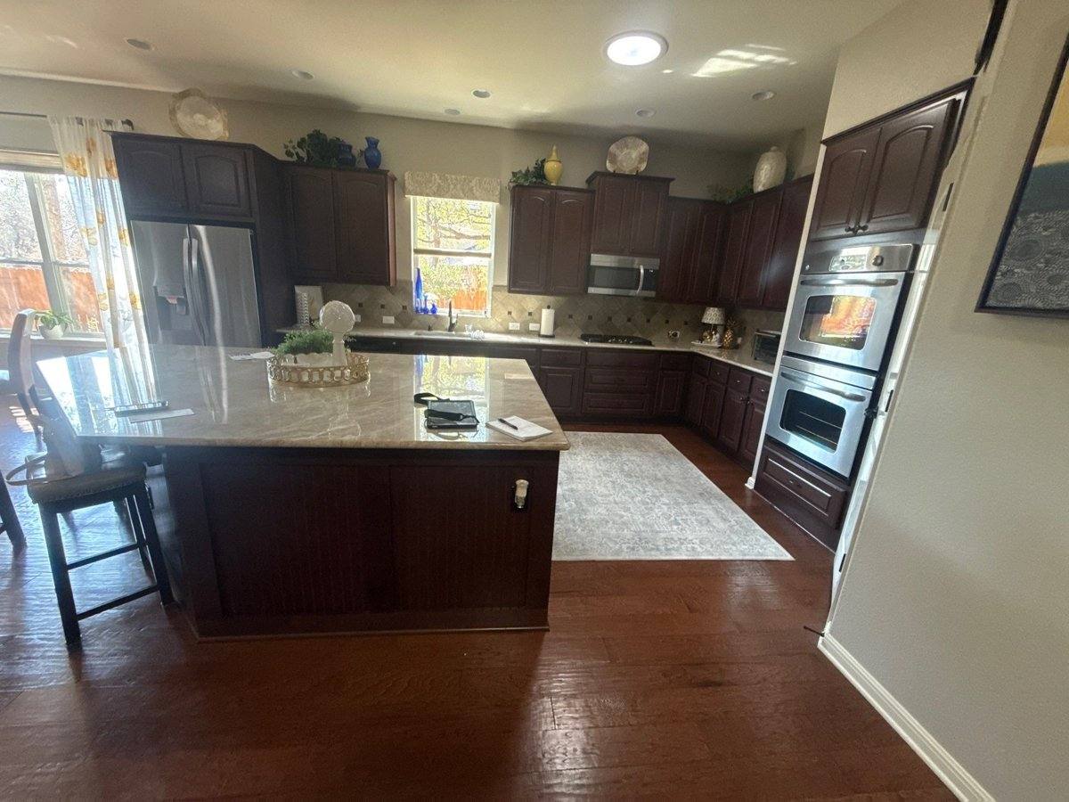 Kitchen cabinets before painting in Cedar Park, TX by Hill Country Painting
