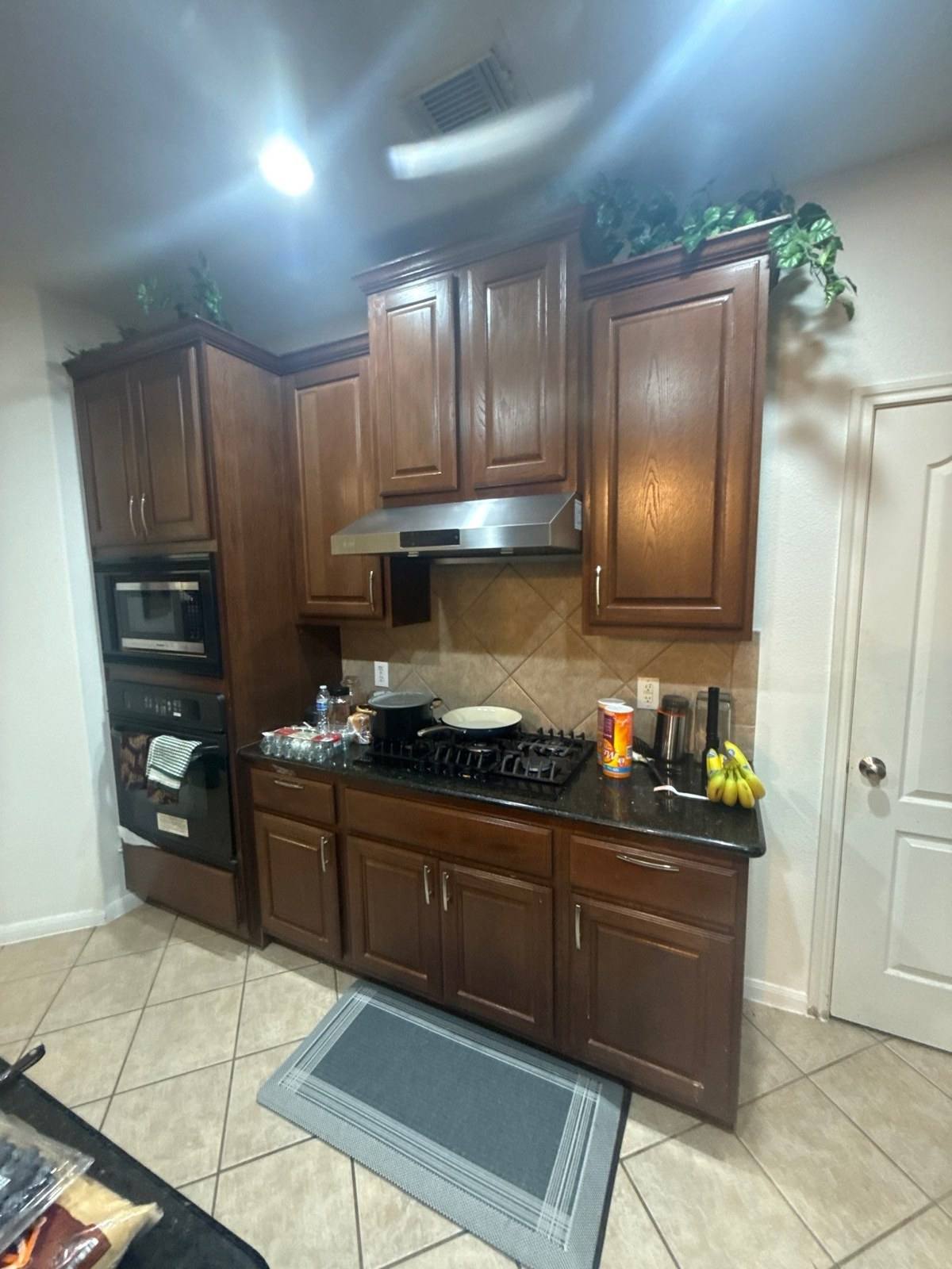 Kitchen cabinets before painting in Cedar Park, TX by Hill Country Painting