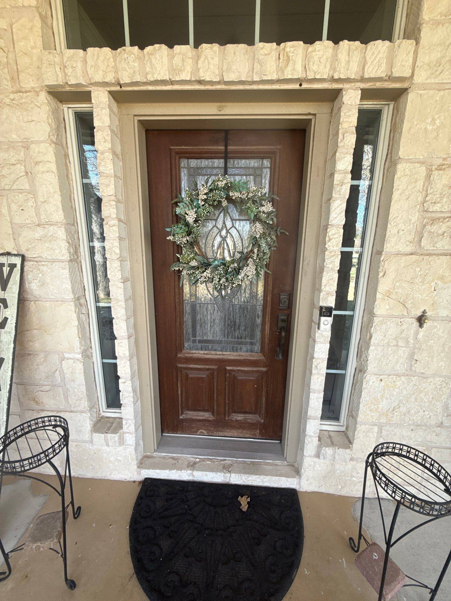 Entry door ahead of exterior refinishing in Georgetown, TX by Hill Country Painting