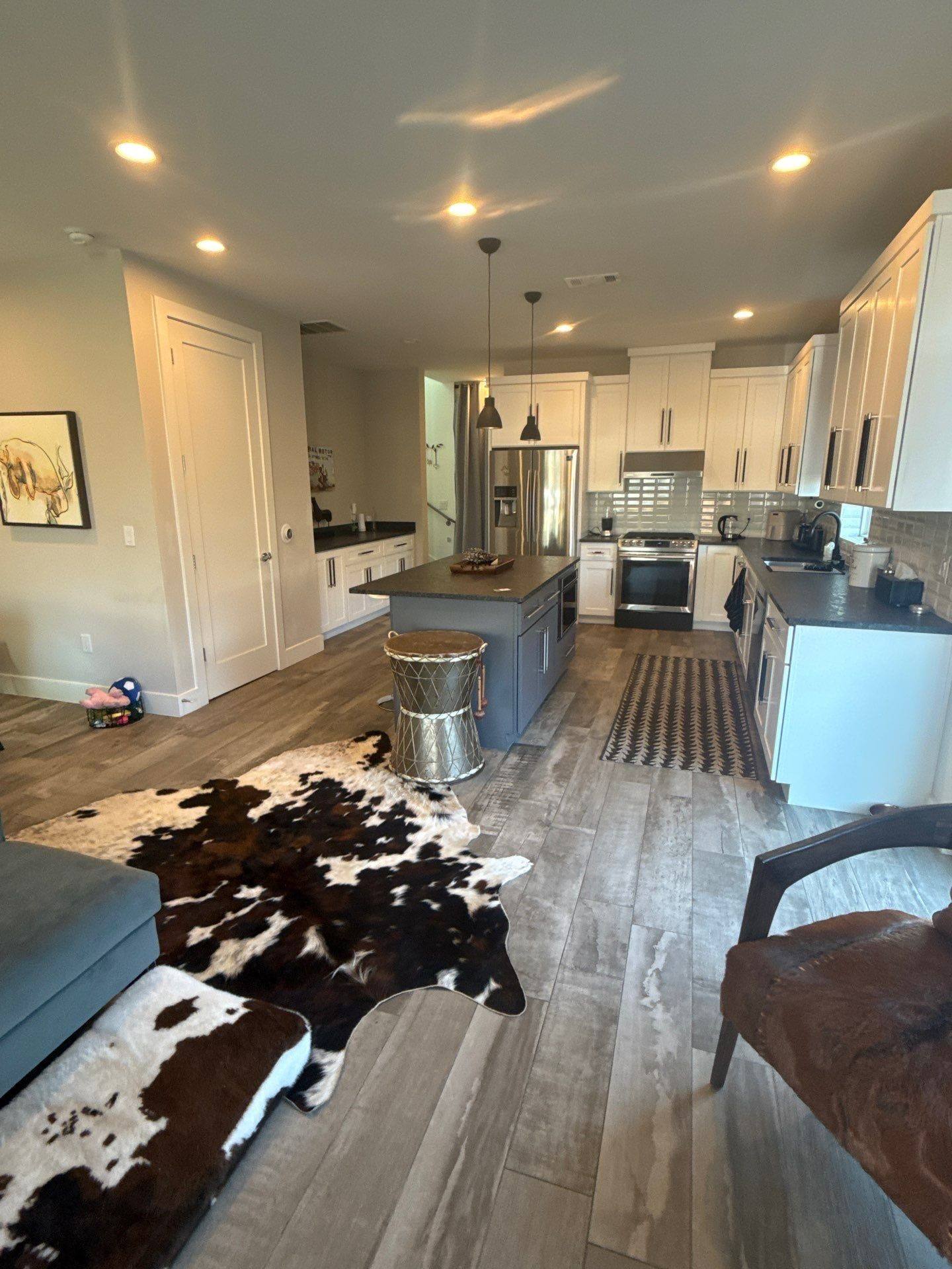 Main house kitchen and living room ahead of interior painting in Austin, TX by Hill Country Painting