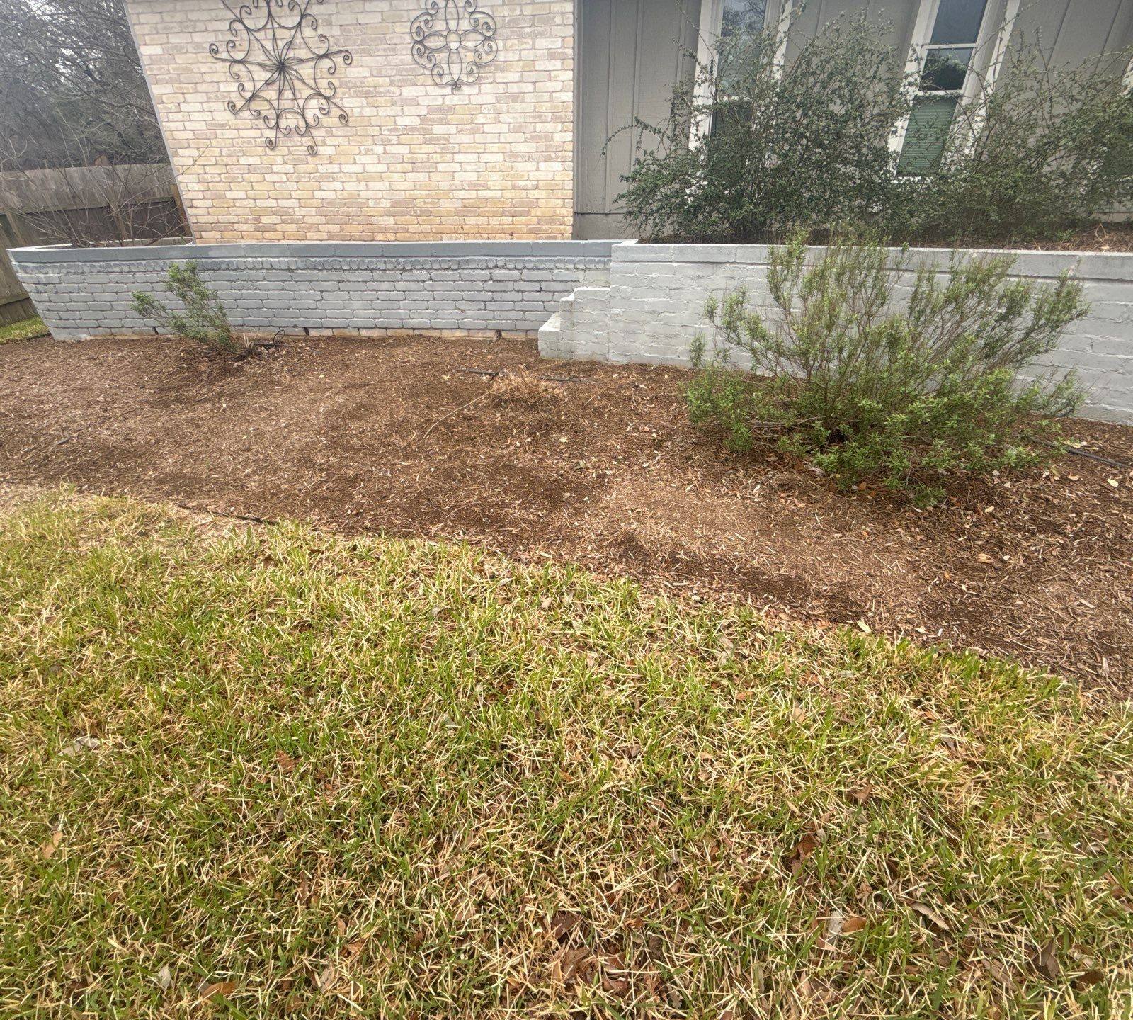 Exterior retaining wall ahead of painting in Austin, TX by Hill Country Painting