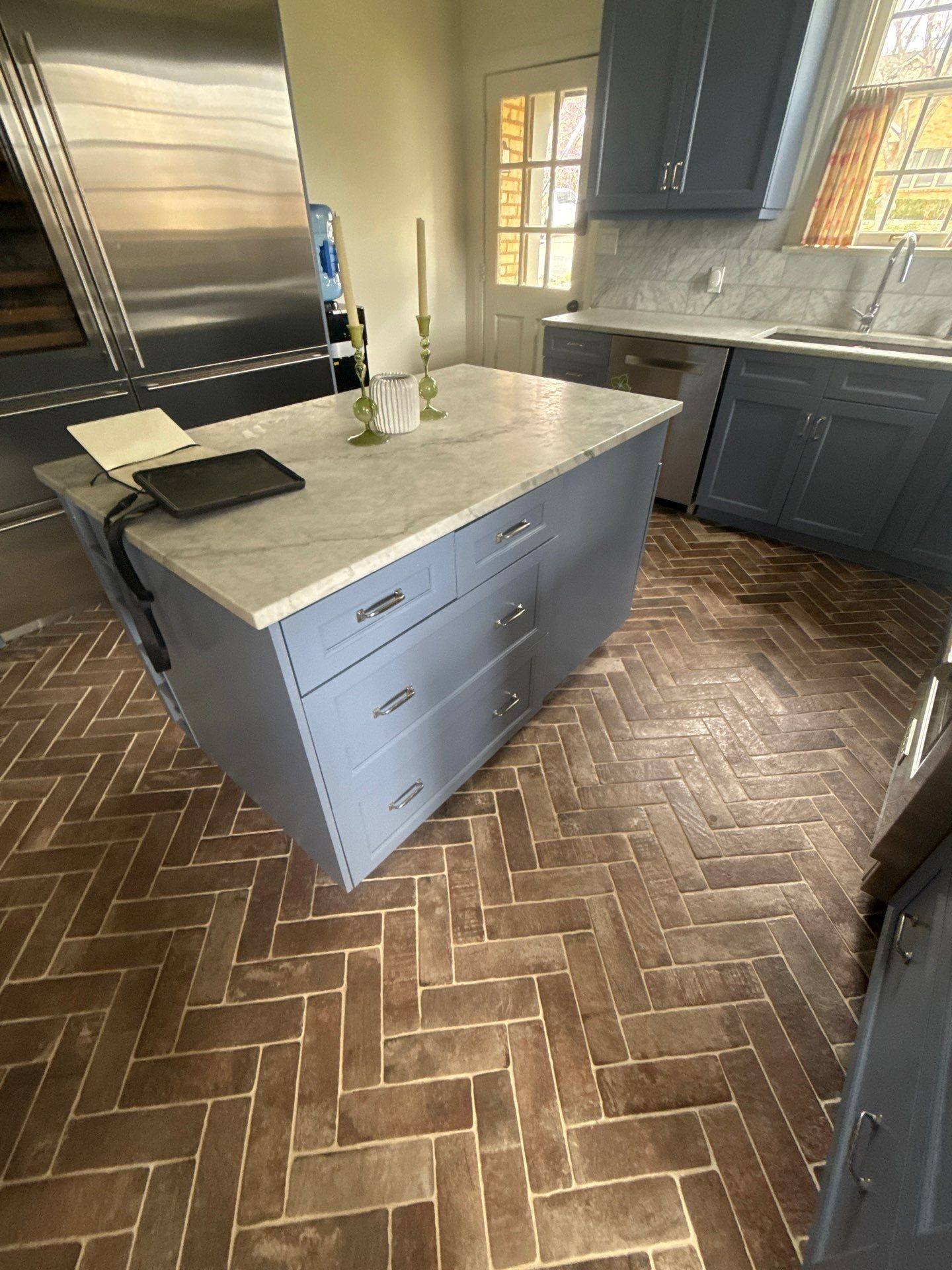 Kitchen island cabinetry ahead of cabinet painting in Austin, TX by Hill Country Painting