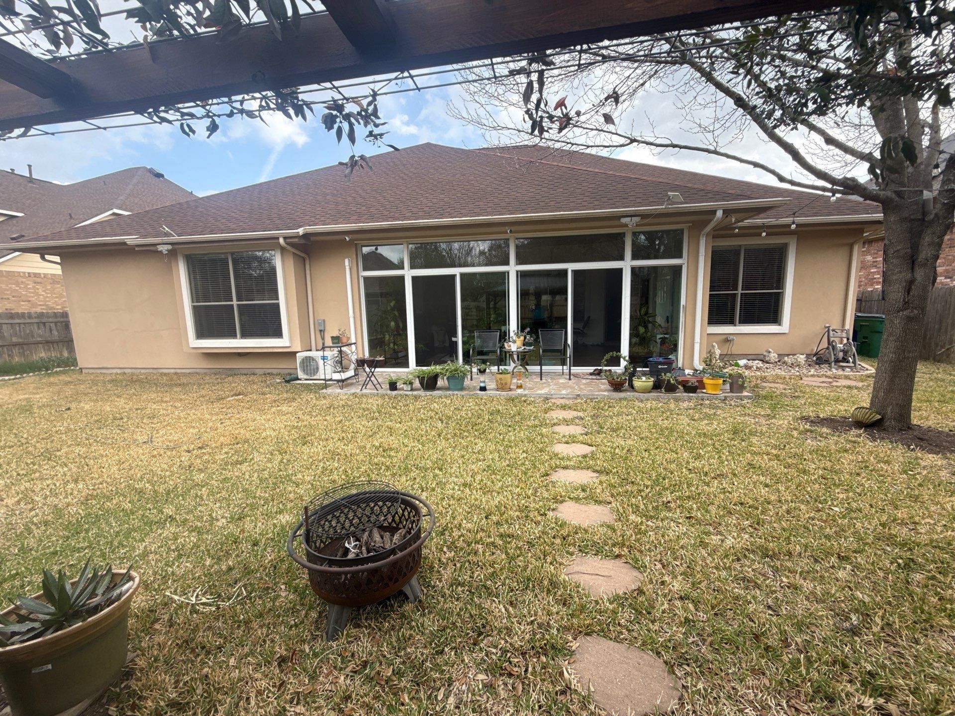 Back exterior of home ahead of exterior painting in Cedar Park, TX by Hill Country Painting