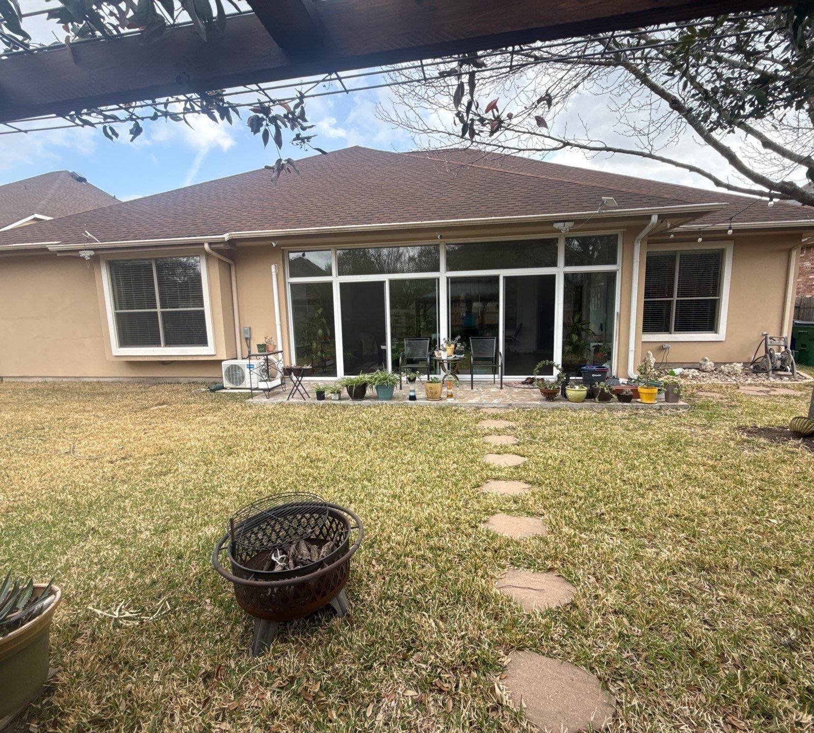 Back exterior of home ahead of exterior painting in Cedar Park, TX by Hill Country Painting