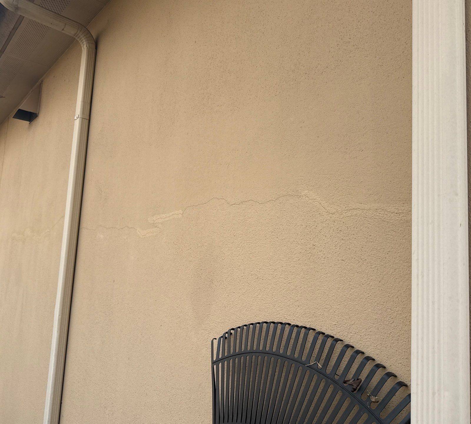 Stucco crack on exterior wall ahead of exterior painting in Cedar Park, TX by Hill Country Painting