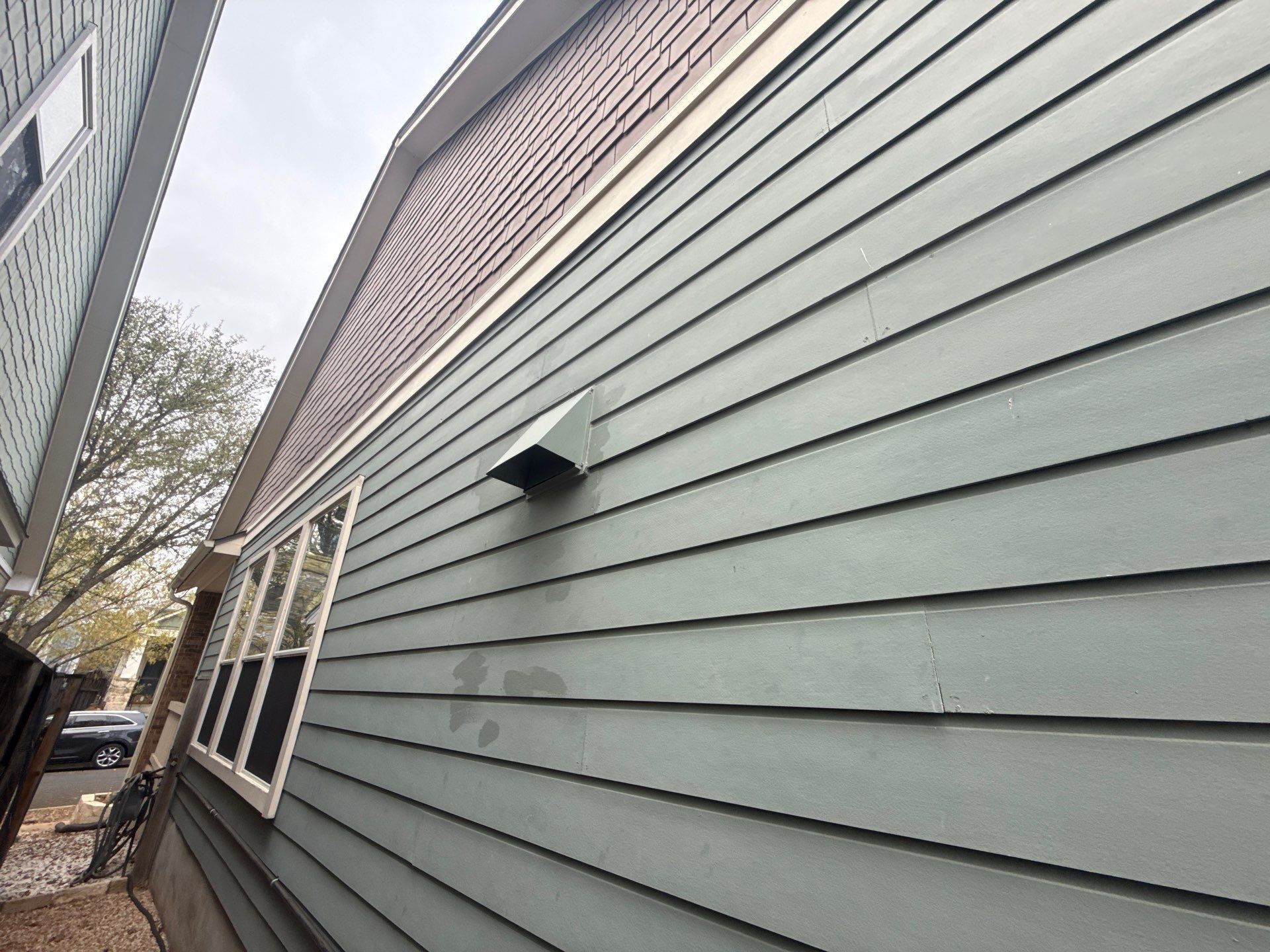 Right side of the house ahead of exterior painting in Austin, TX by Hill Country Painting