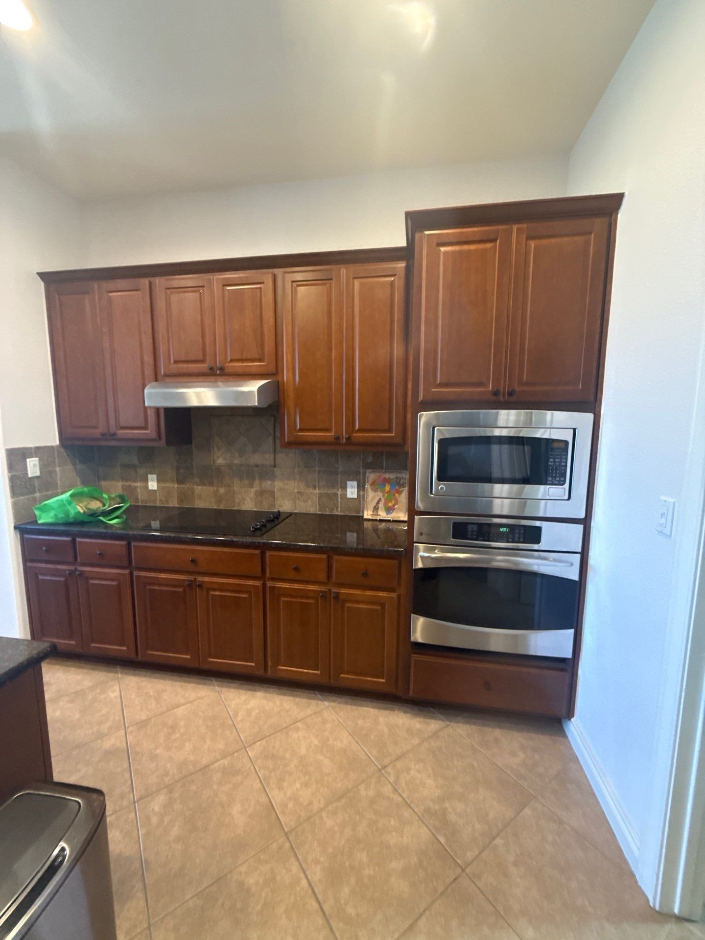 Kitchen cabinet wall ahead of cabinet painting in Dripping Springs, TX by Hill Country Painting