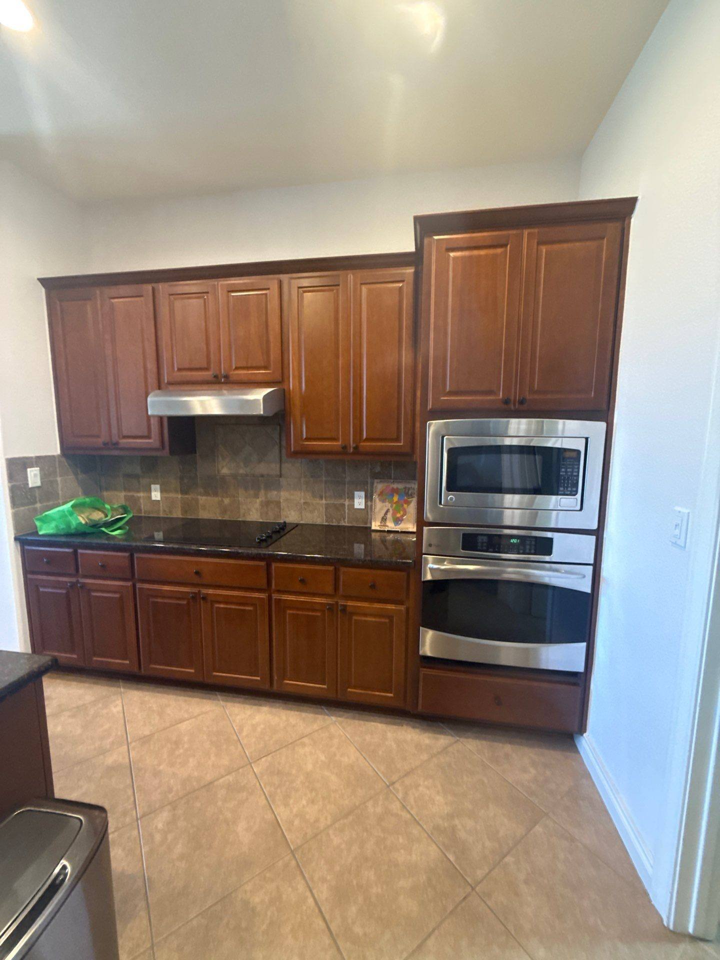 Kitchen cabinet wall ahead of cabinet painting in Dripping Springs, TX by Hill Country Painting