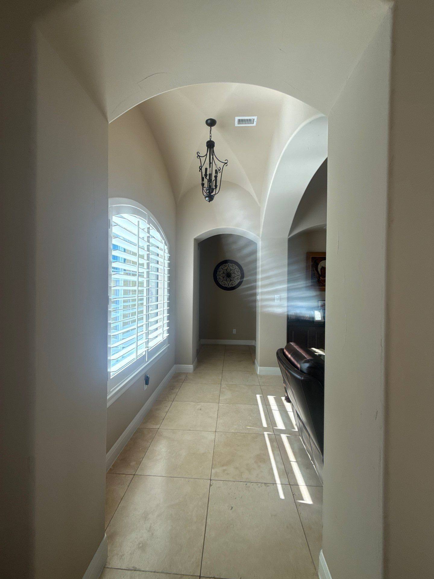 Arched hallway ahead of interior painting in Leander, TX by Hill Country Painting