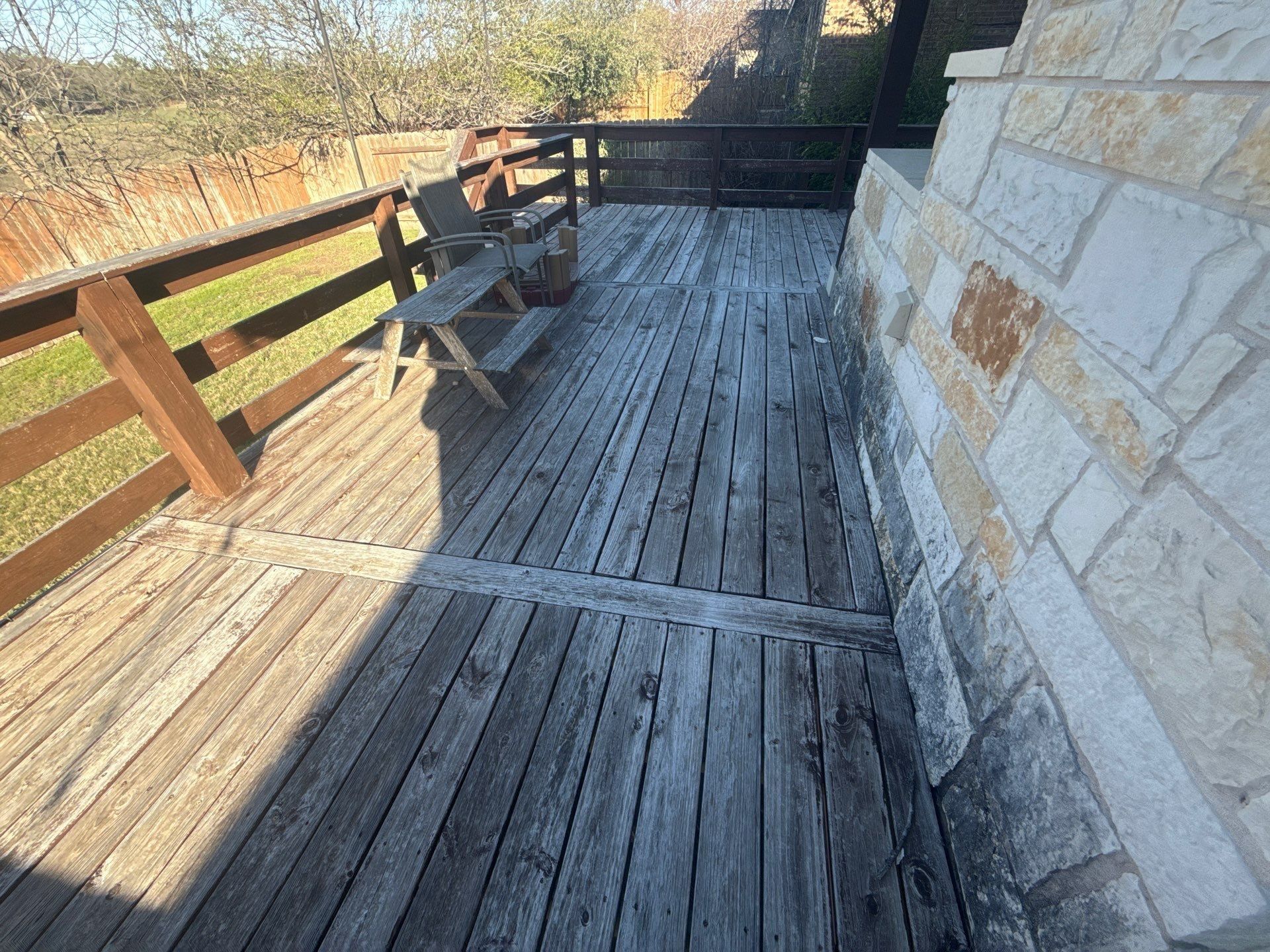 Deck ahead of staining in Cedar Park, TX by Hill Country Painting