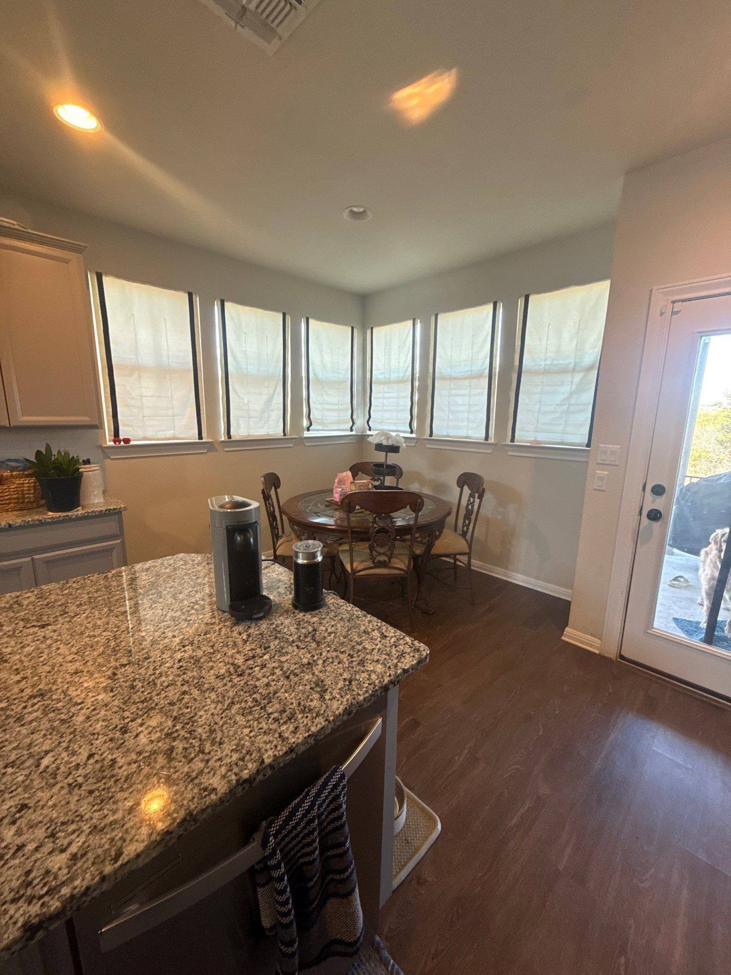 Kitchen and dining area ahead of interior painting in Austin, TX by Hill Country Painting