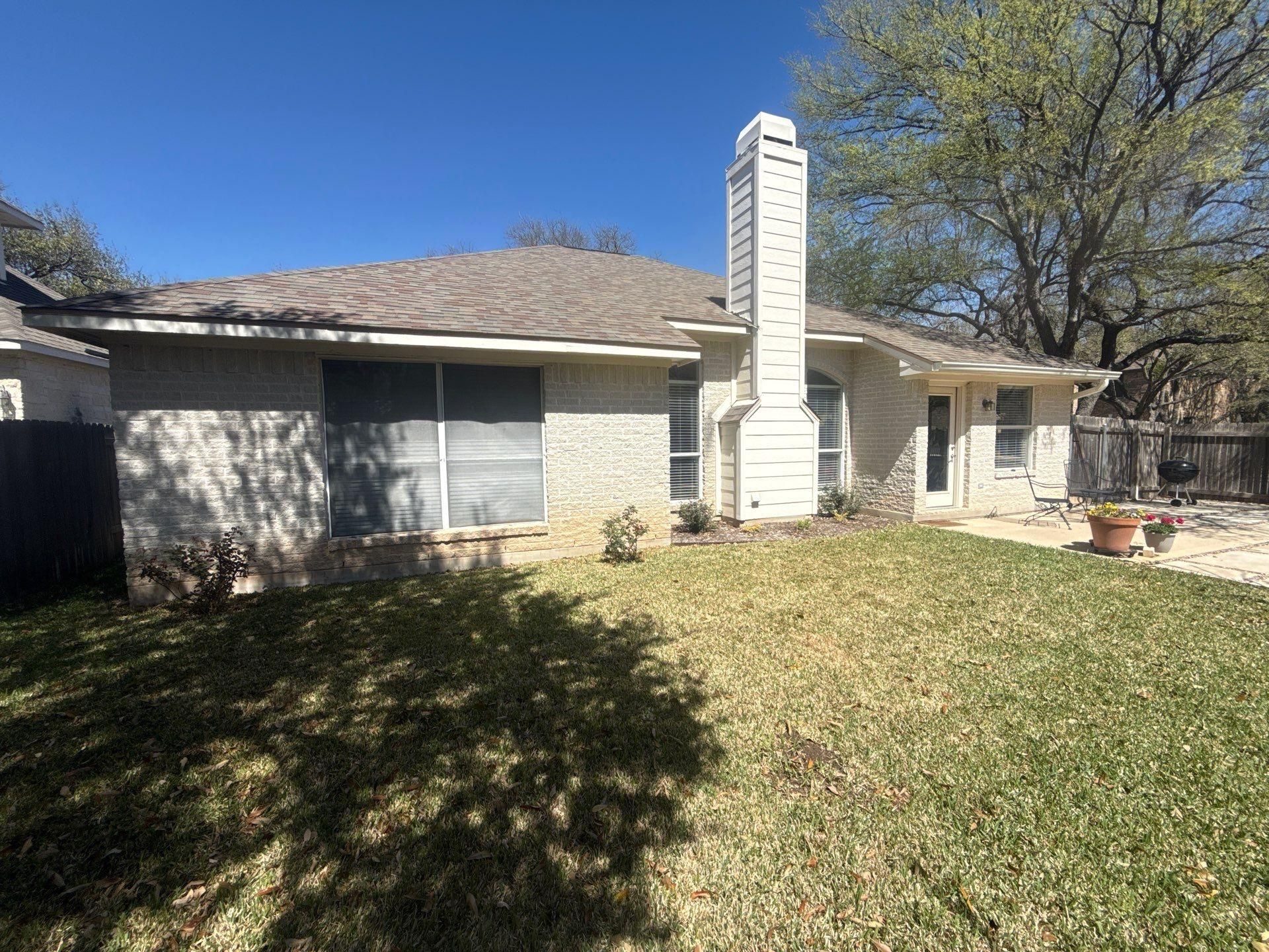Back of house ahead of exterior painting in Cedar Park, TX by Hill Country Painting