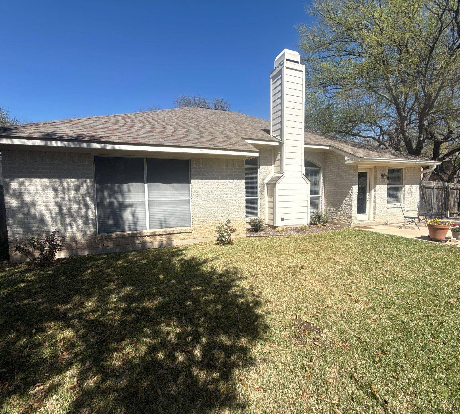 Back of house ahead of exterior painting in Cedar Park, TX by Hill Country Painting