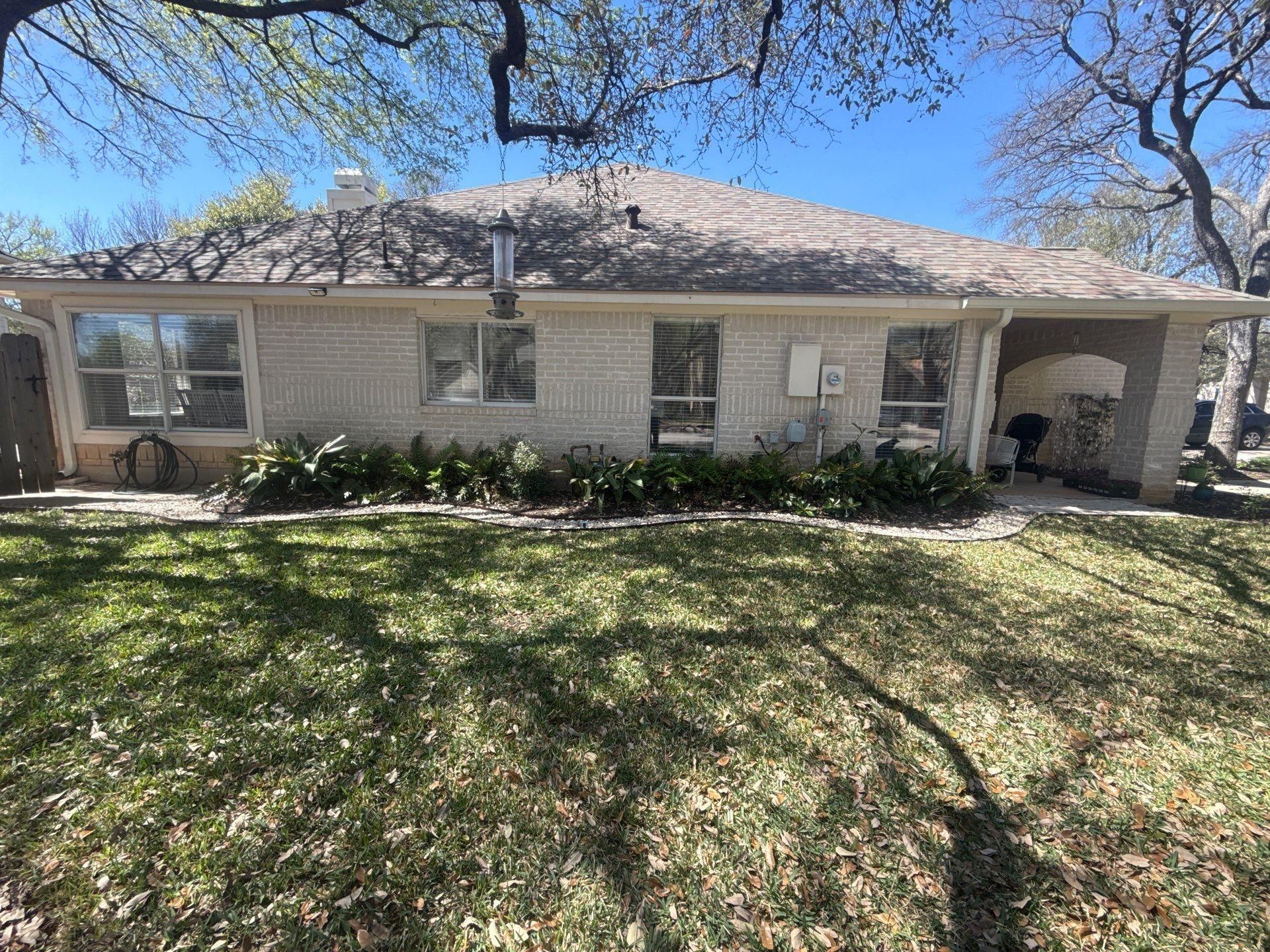 Left side of house ahead of exterior painting in Cedar Park, TX by Hill Country Painting