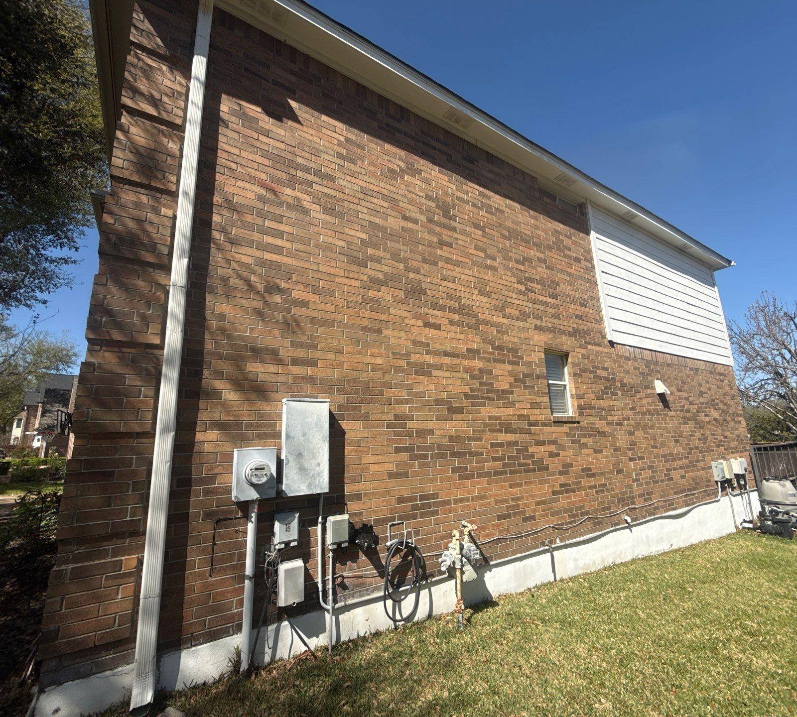 Side of house ahead of exterior painting in Round Rock, TX by Hill Country Painting