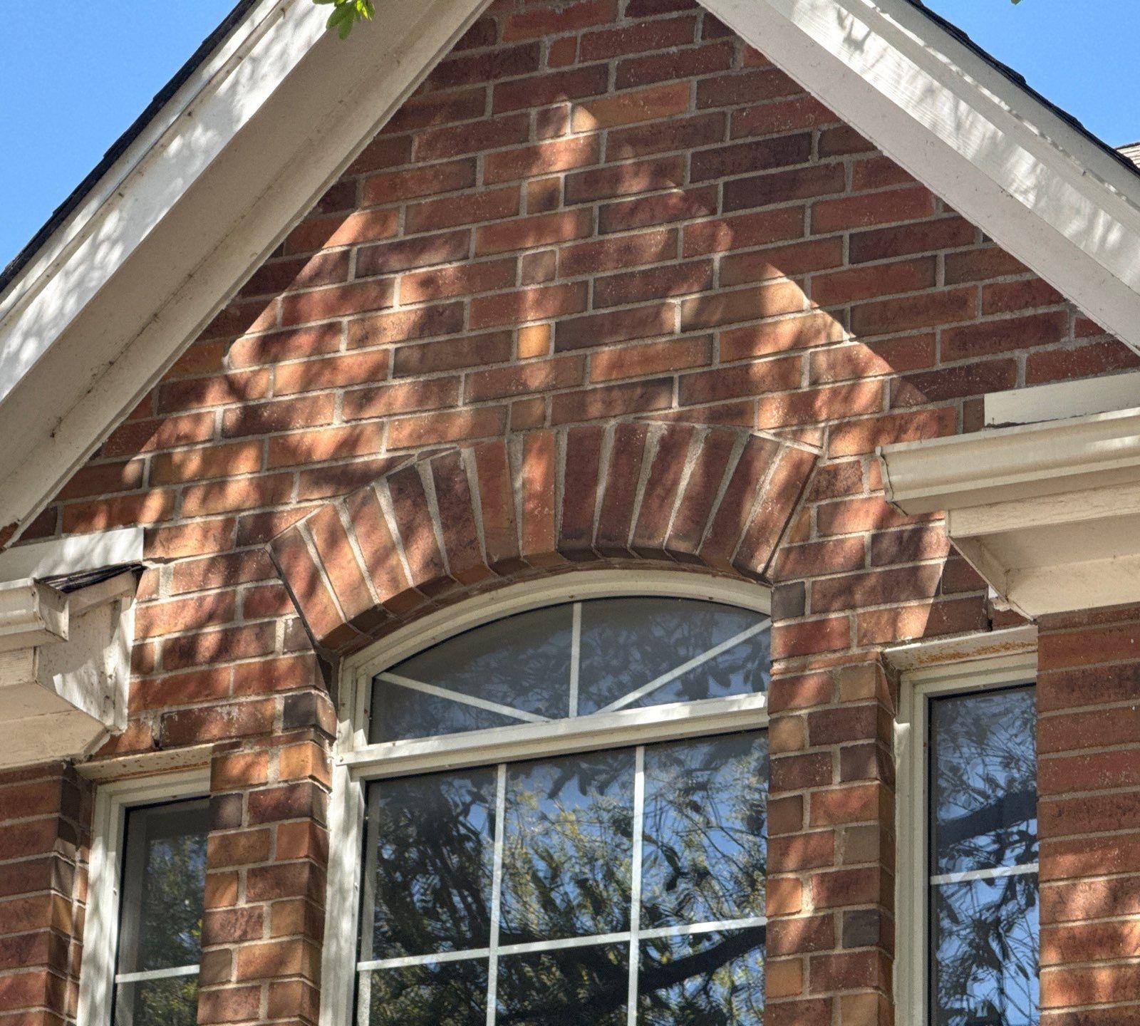 Front gable trim ahead of carpentry repair and painting in Round Rock, TX by Hill Country Painting