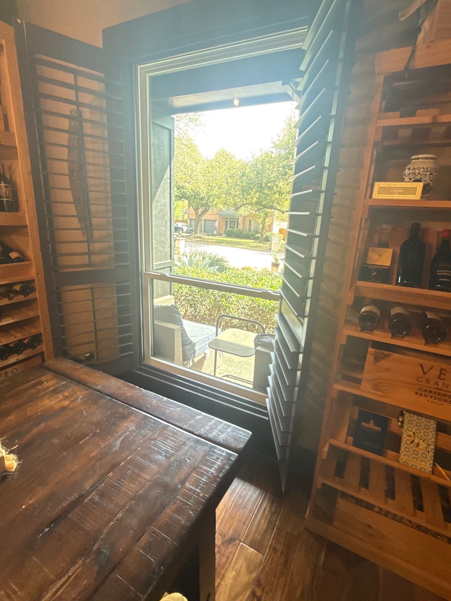Wine room shutters ahead of interior painting in Austin, TX by Hill Country Painting