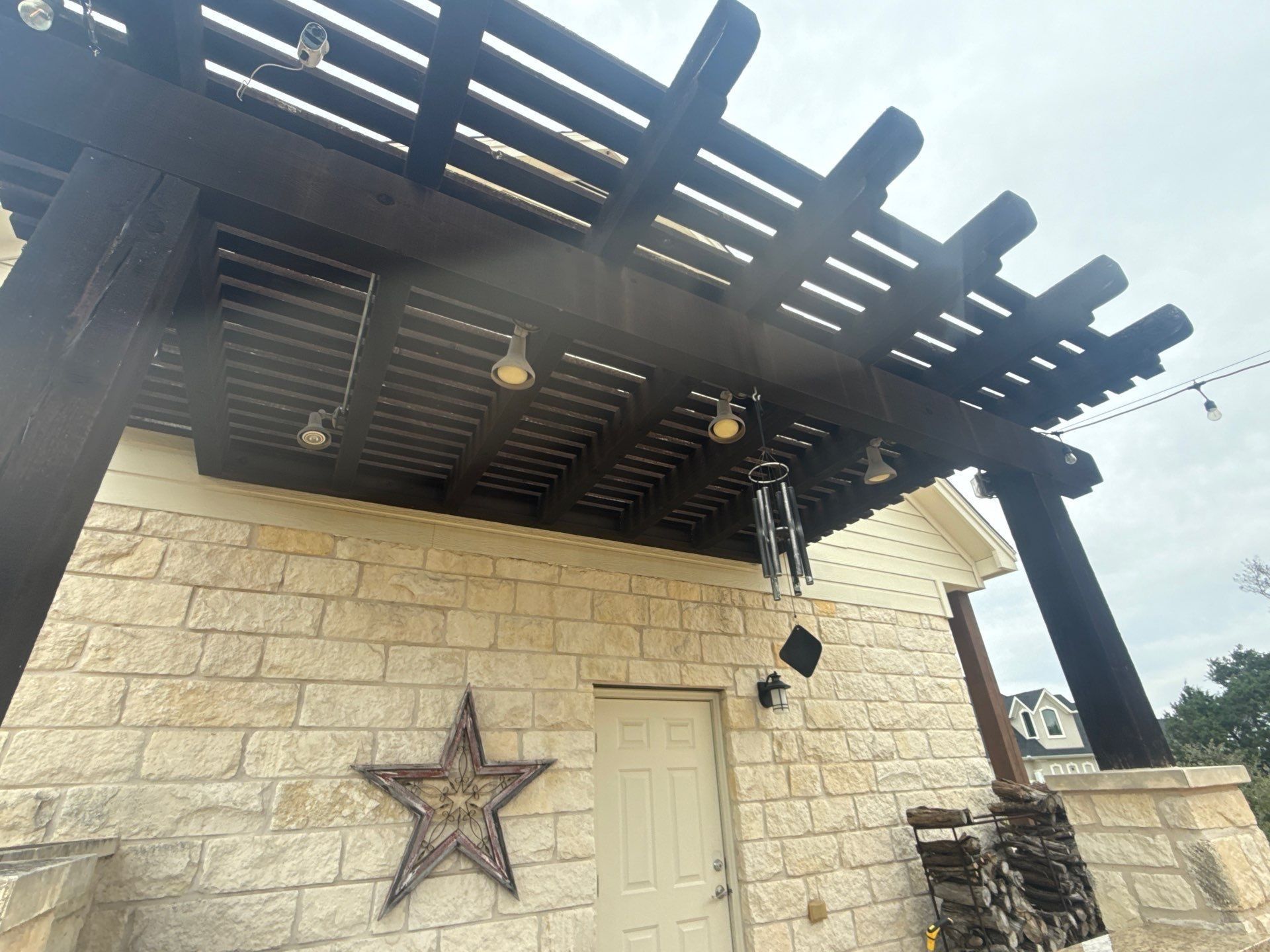 Pergola and porch ceiling ahead of staining and painting in Leander, TX by Hill Country Painting