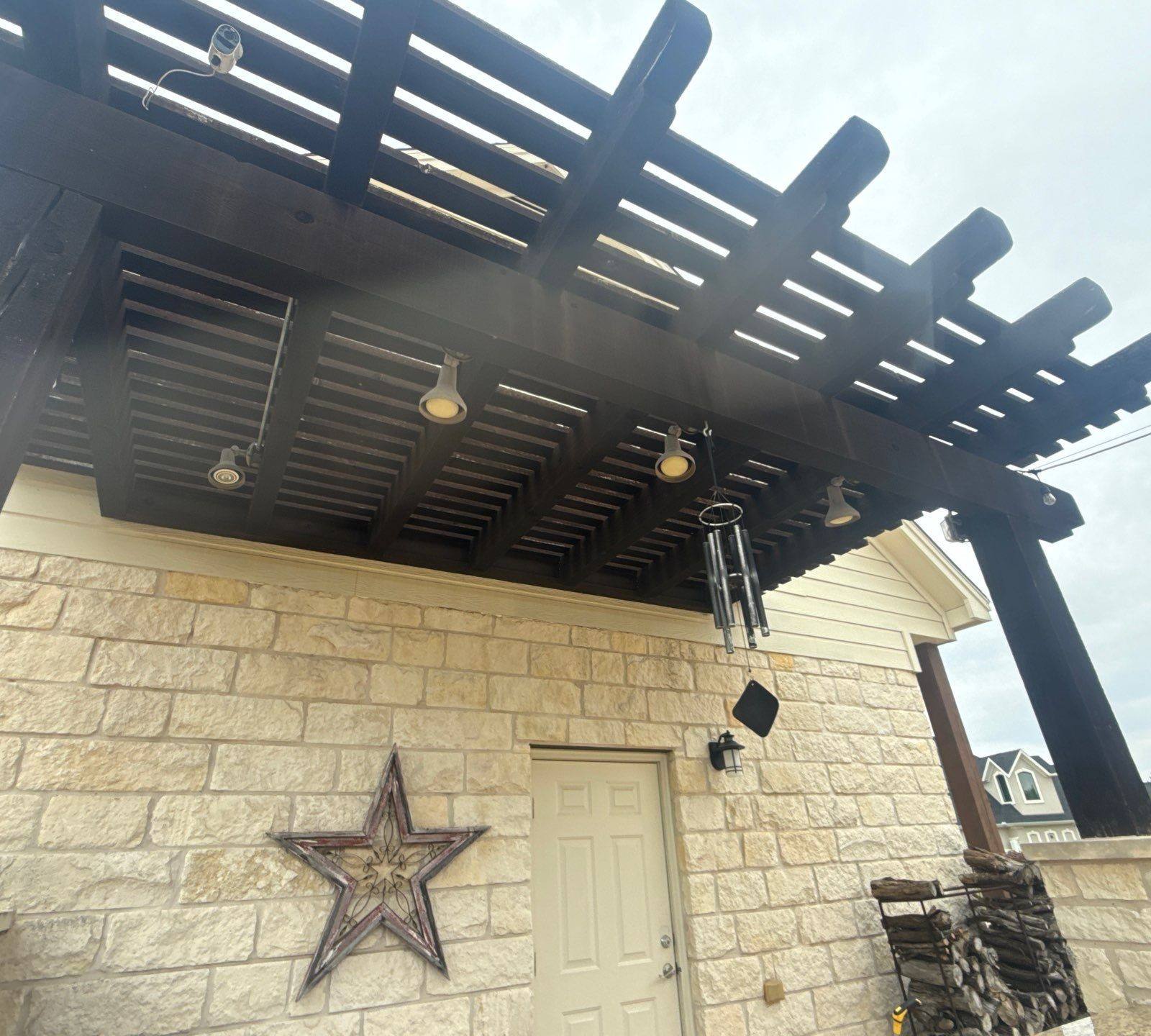 Pergola and porch ceiling ahead of staining and painting in Leander, TX by Hill Country Painting