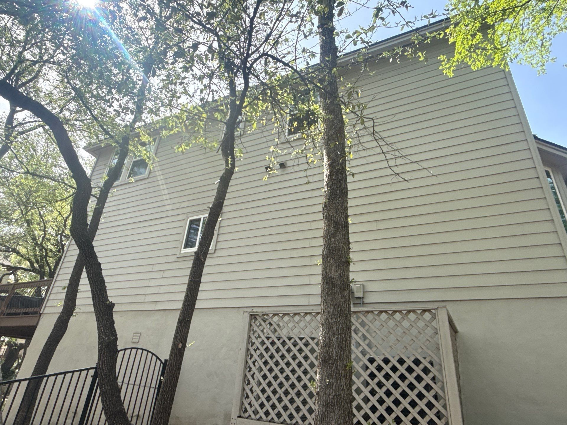 Side of house ahead of exterior painting in Austin, TX by Hill Country Painting