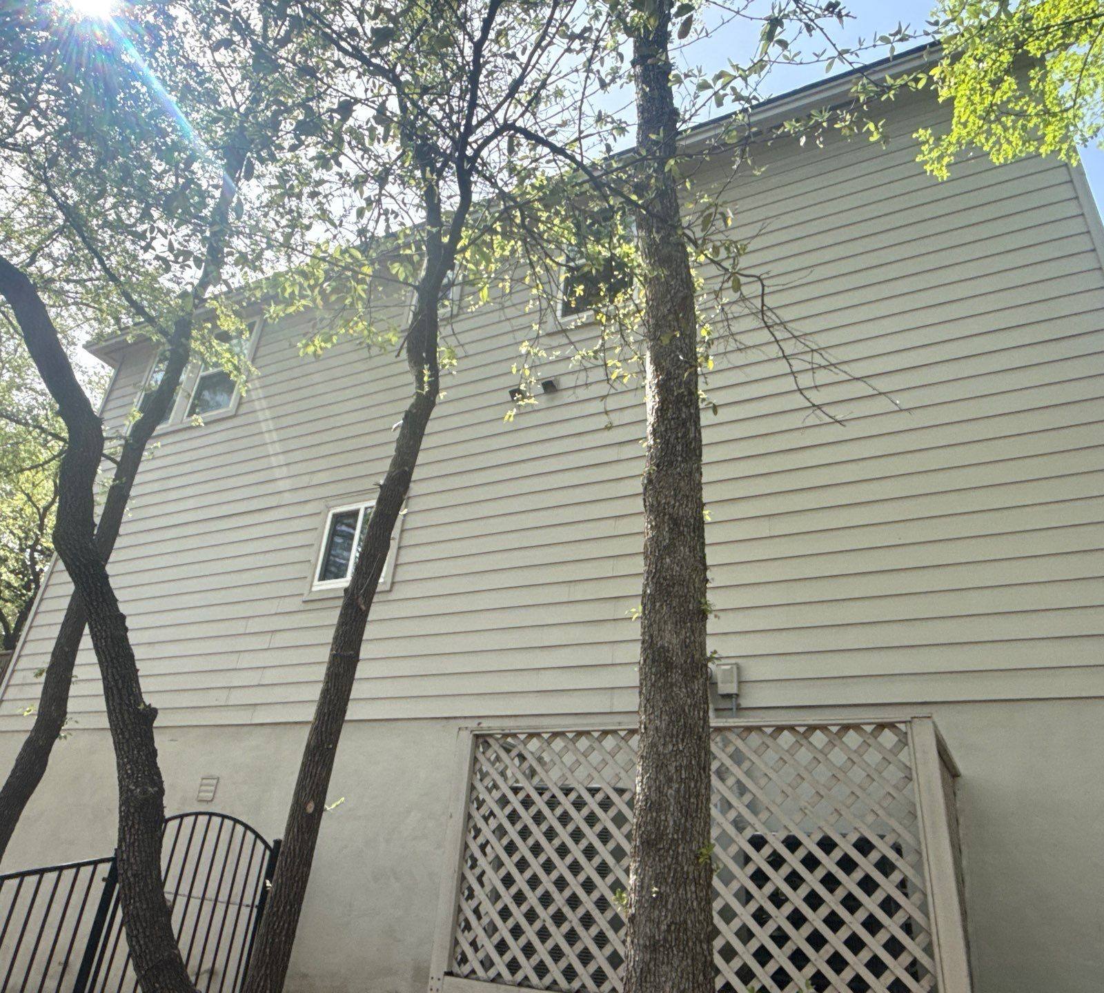 Side of house ahead of exterior painting in Austin, TX by Hill Country Painting