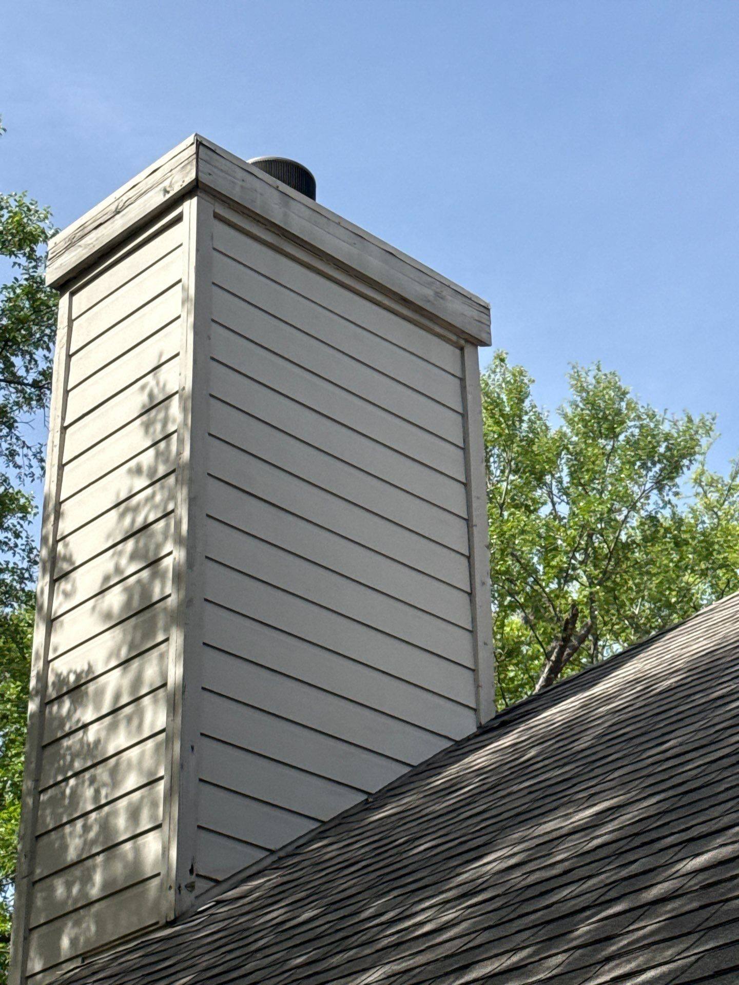 Chimney ahead of carpentry repair and painting in Austin, TX by Hill Country Painting