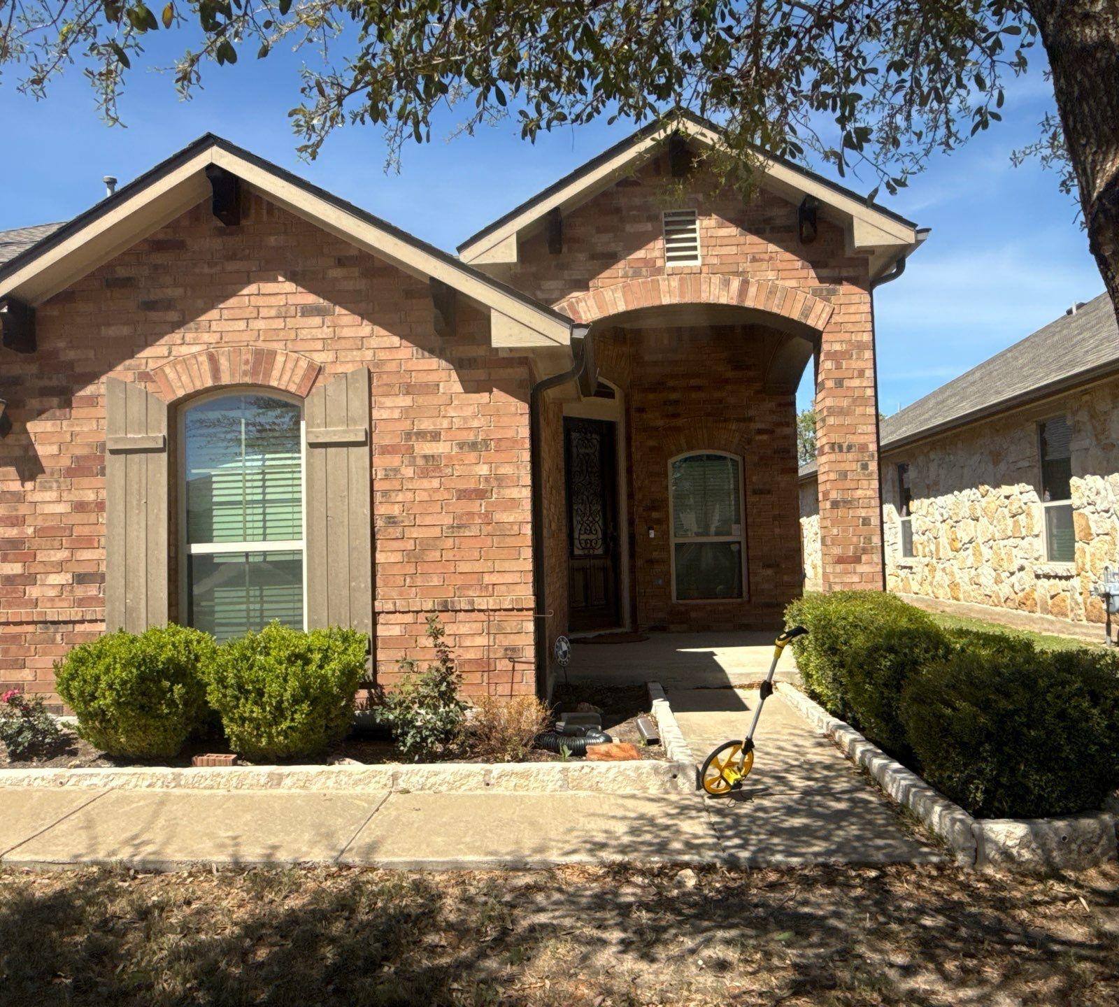 Front entry ahead of exterior painting in Leander, TX by Hill Country Painting