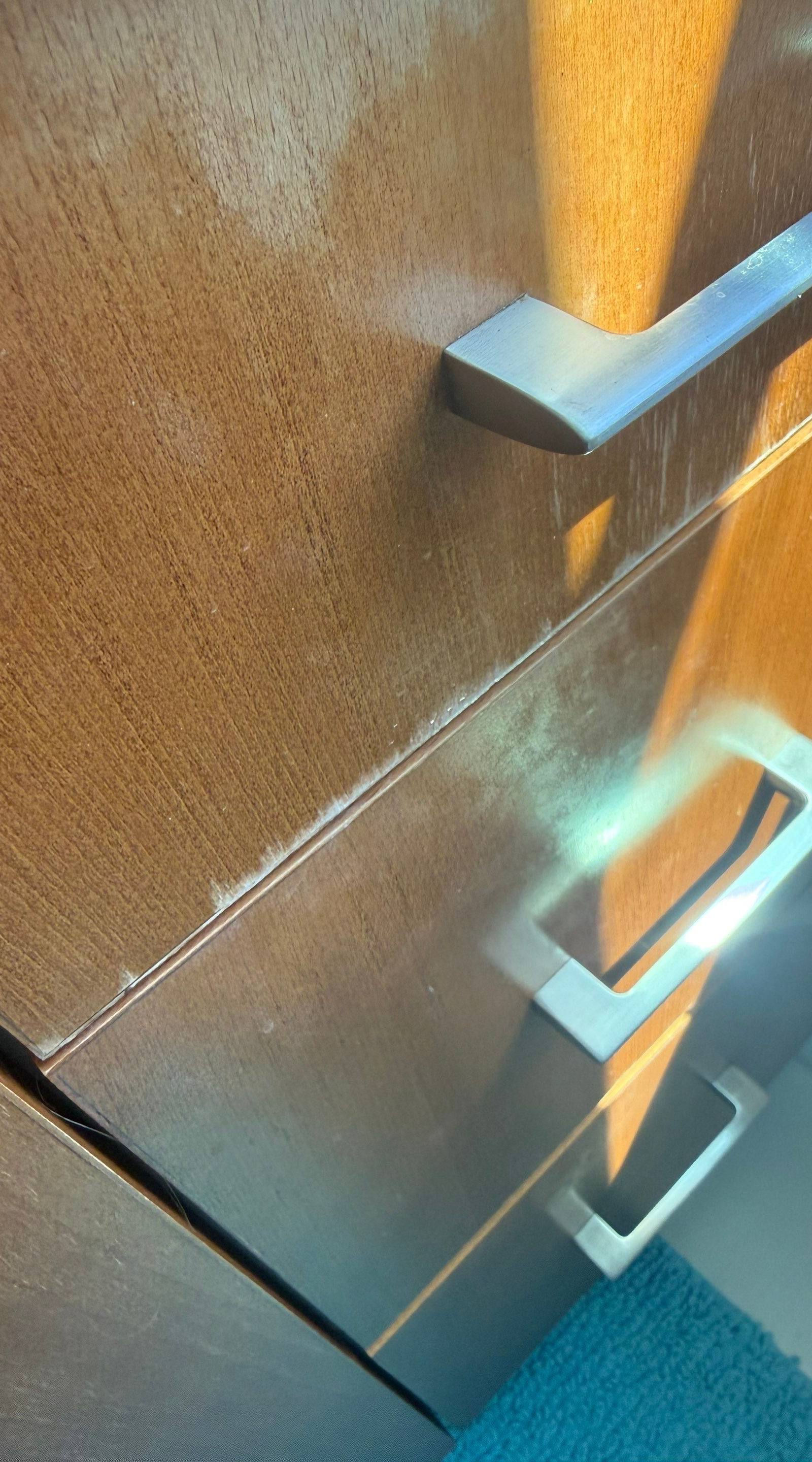 Cabinet door detail ahead of cabinet painting in Austin, TX by Hill Country Painting