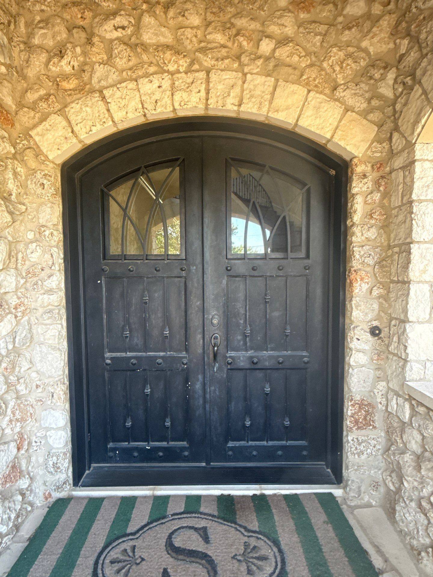 Metal entry door ahead of painting in Austin, TX by Hill Country Painting
