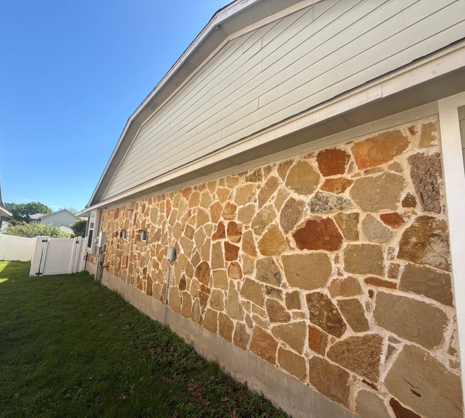 Left side of house ahead of exterior painting in Pflugerville, TX by Hill Country Painting