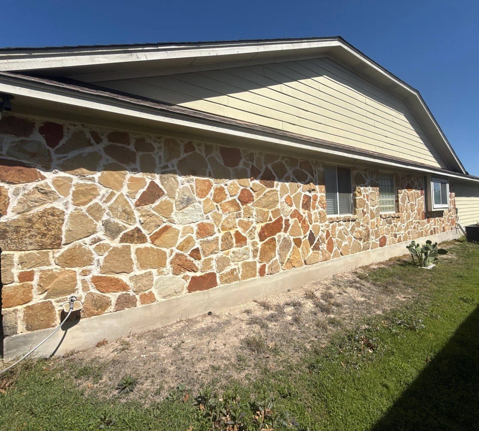 Right side of house ahead of exterior painting in Pflugerville, TX by Hill Country Painting