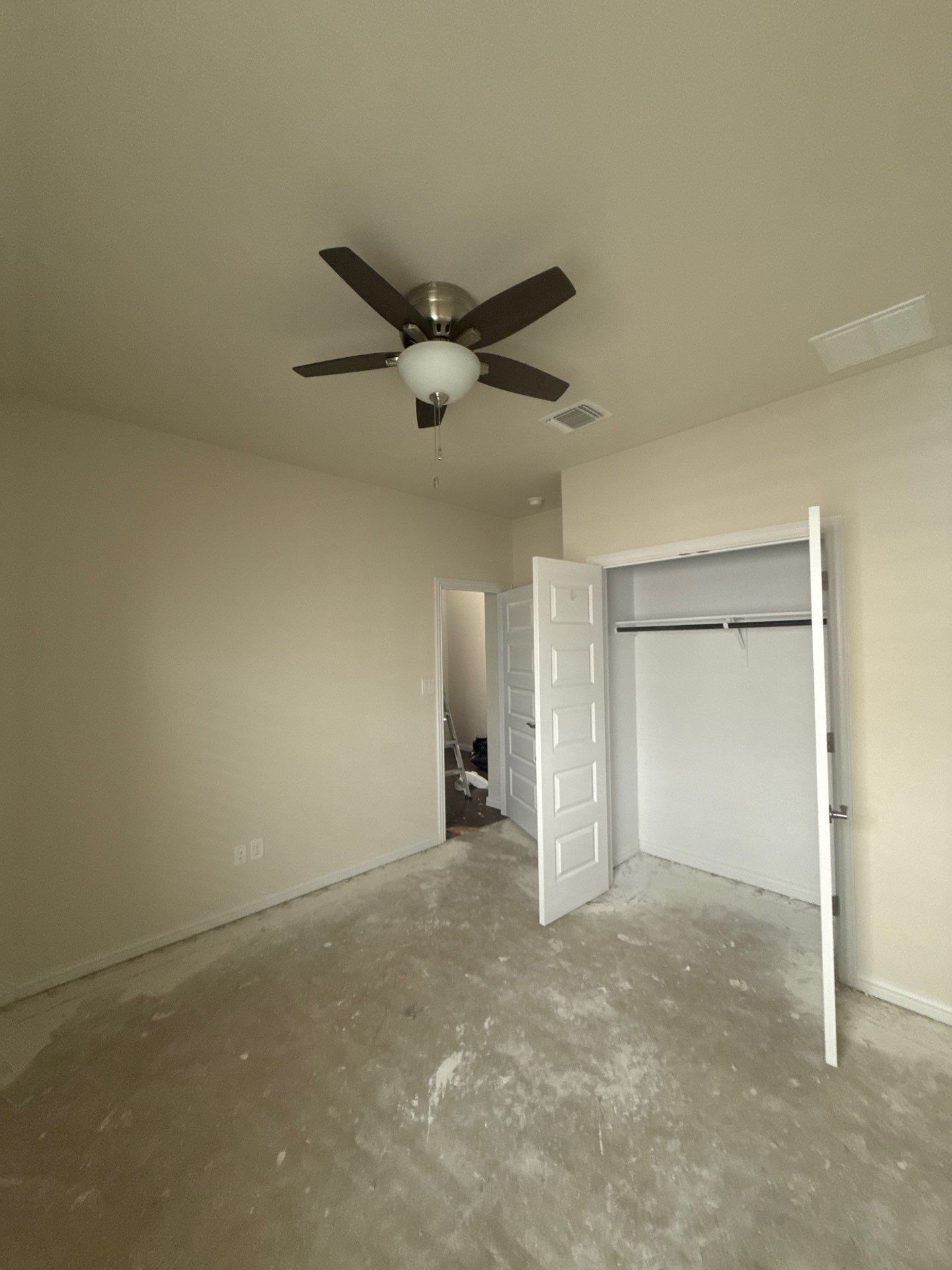 Back bedroom ahead of interior painting in Buda, TX by Hill Country Painting