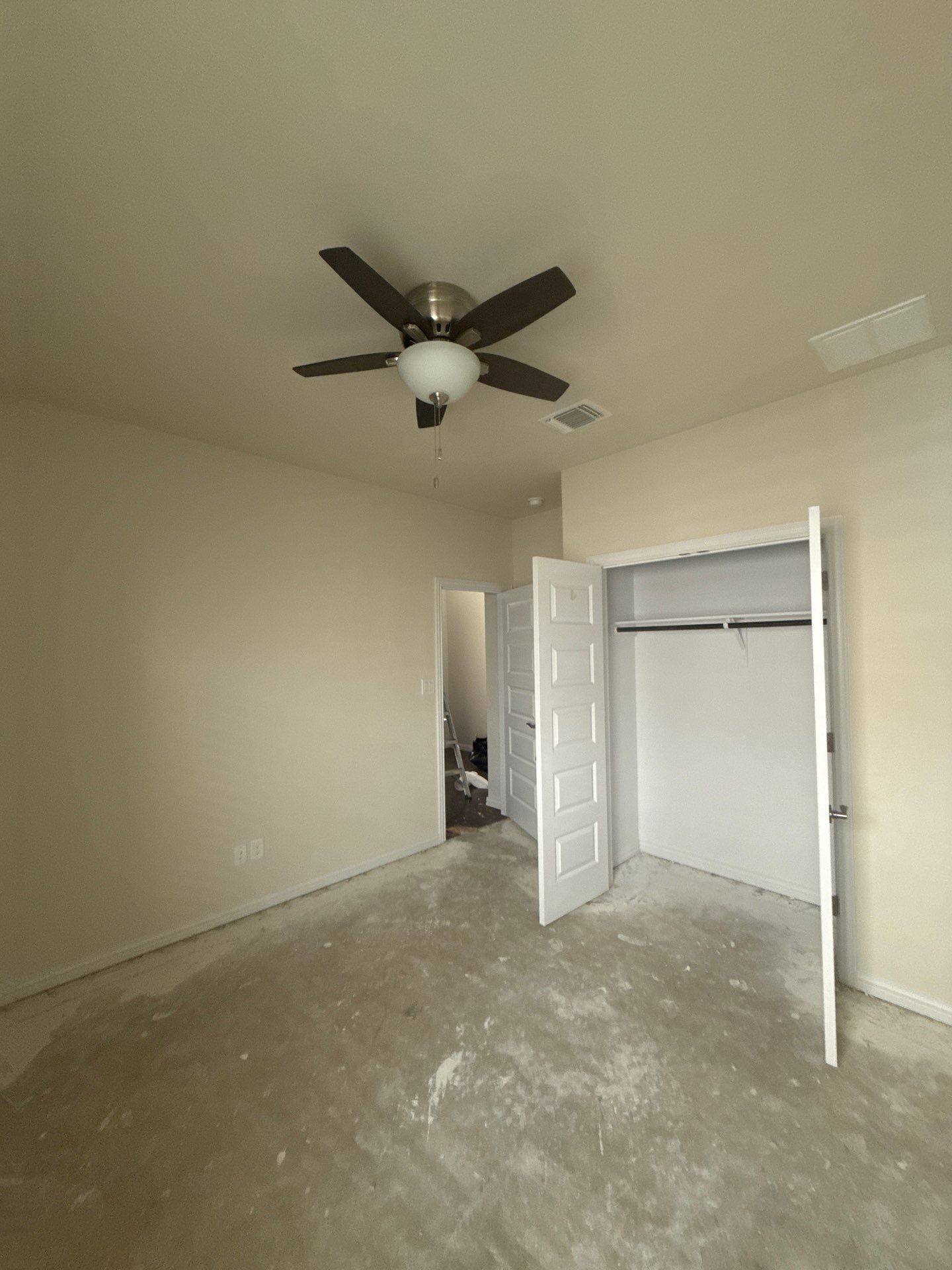 Back bedroom ahead of interior painting in Buda, TX by Hill Country Painting