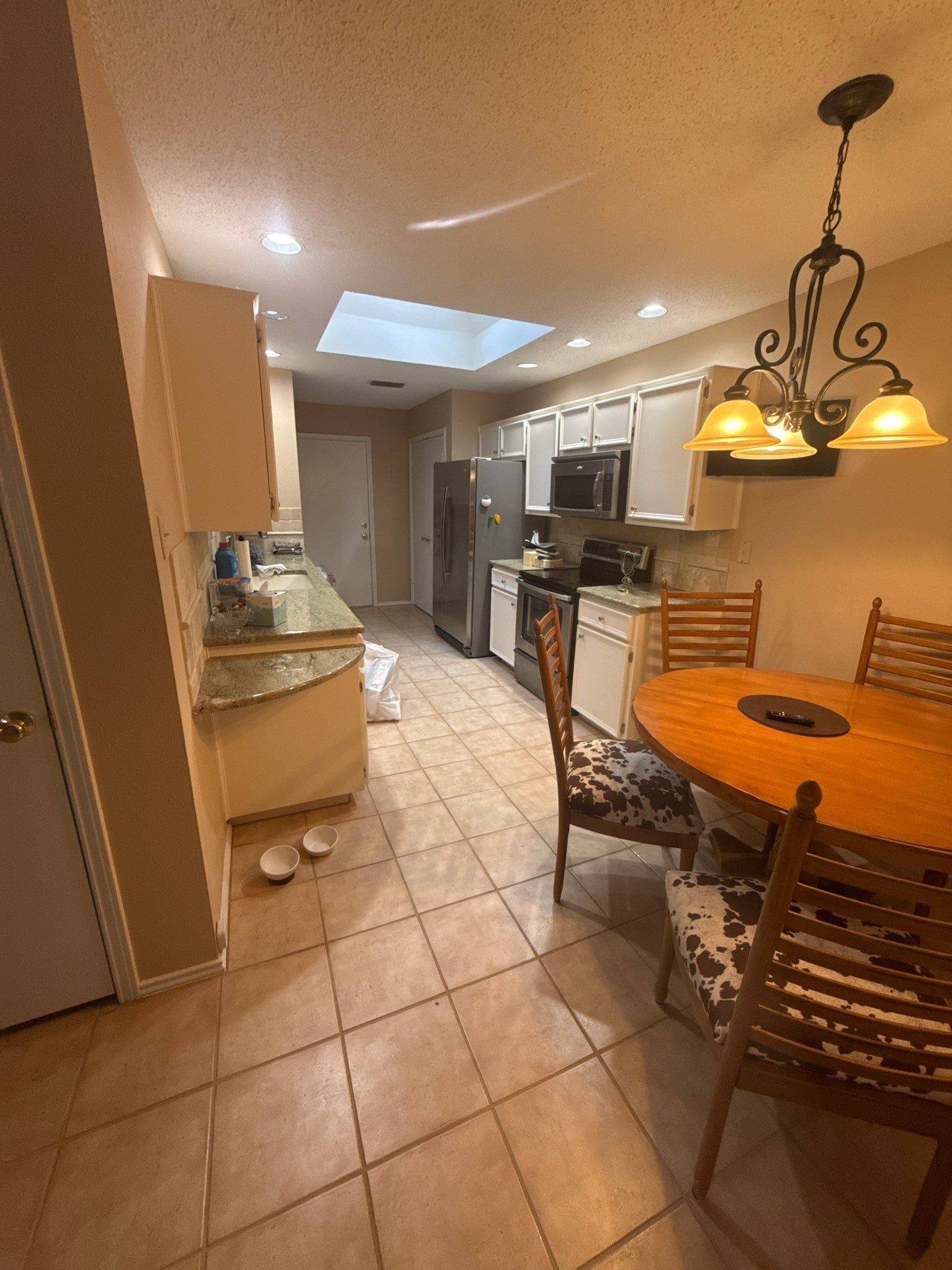 Kitchen and dining area ahead of interior painting in Lakeway, TX by Hill Country Painting