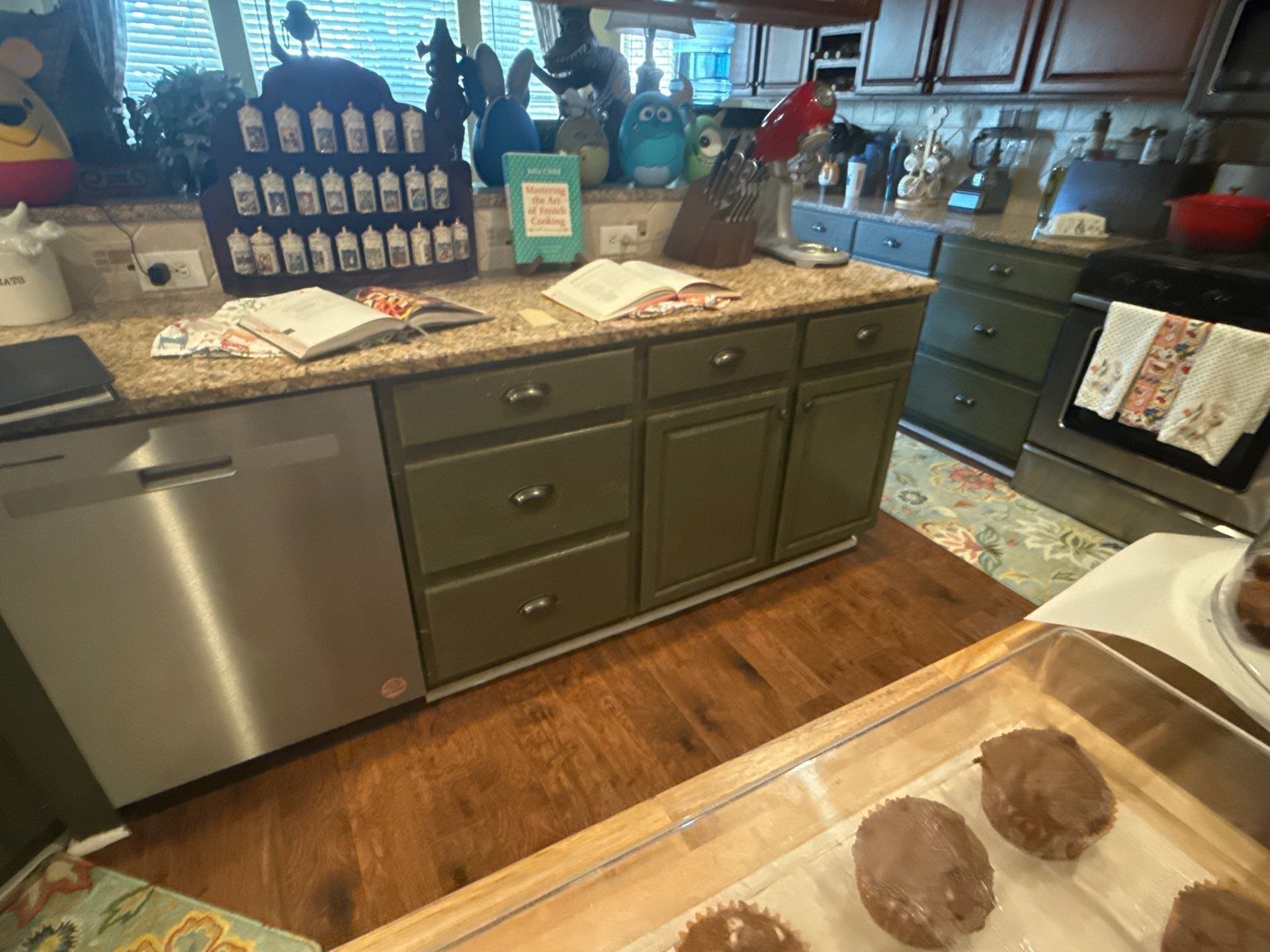 Kitchen cabinetry near dishwasher and range ahead of cabinet painting in Cedar Park, TX by Hill Country Painting