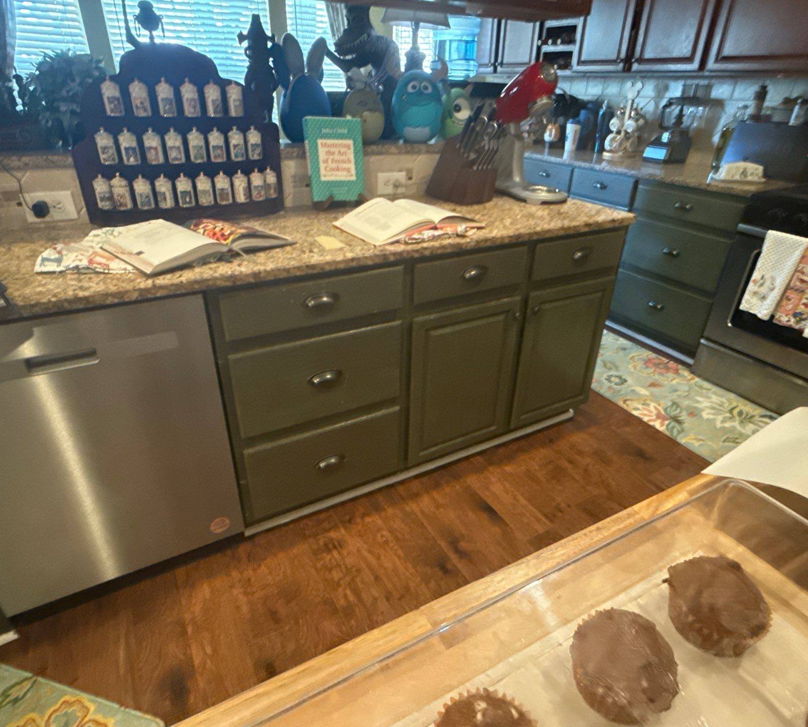 Kitchen cabinetry near dishwasher and range ahead of cabinet painting in Cedar Park, TX by Hill Country Painting