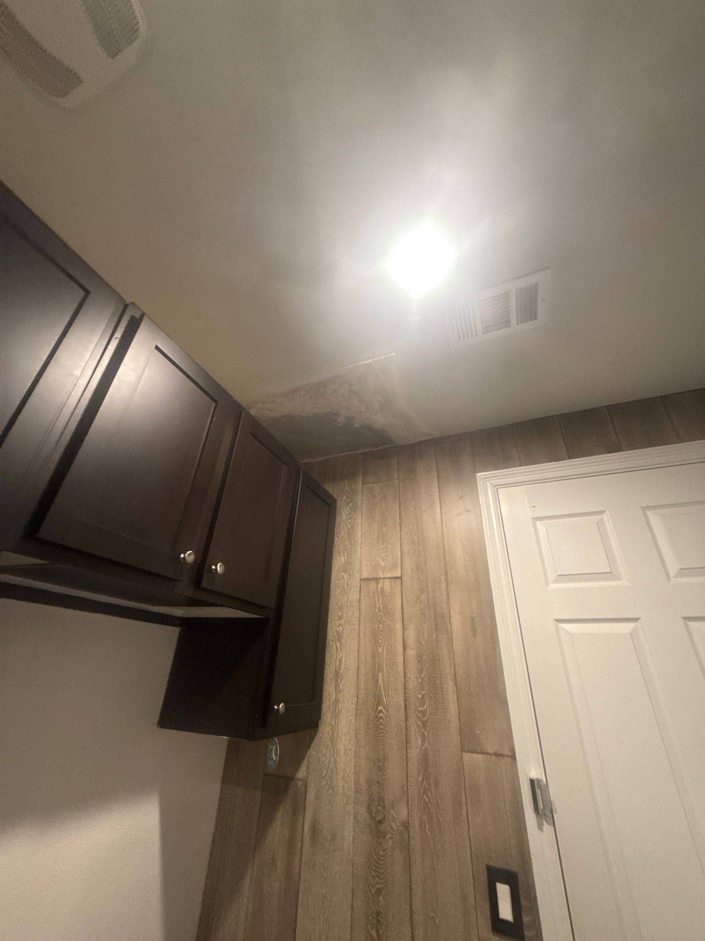 Laundry room ceiling ahead of interior painting in Austin, TX by Hill Country Painting