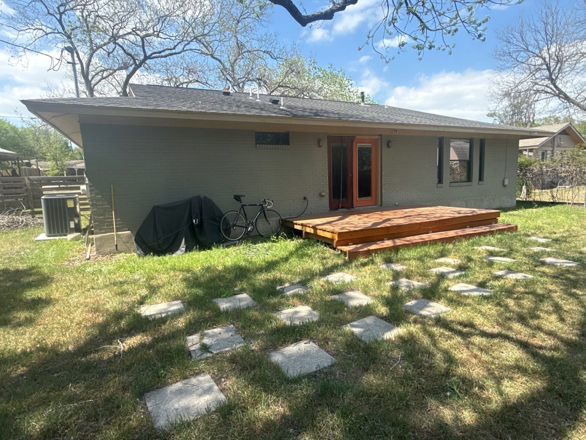 Back exterior and deck ahead of painting in Austin, TX by Hill Country Painting